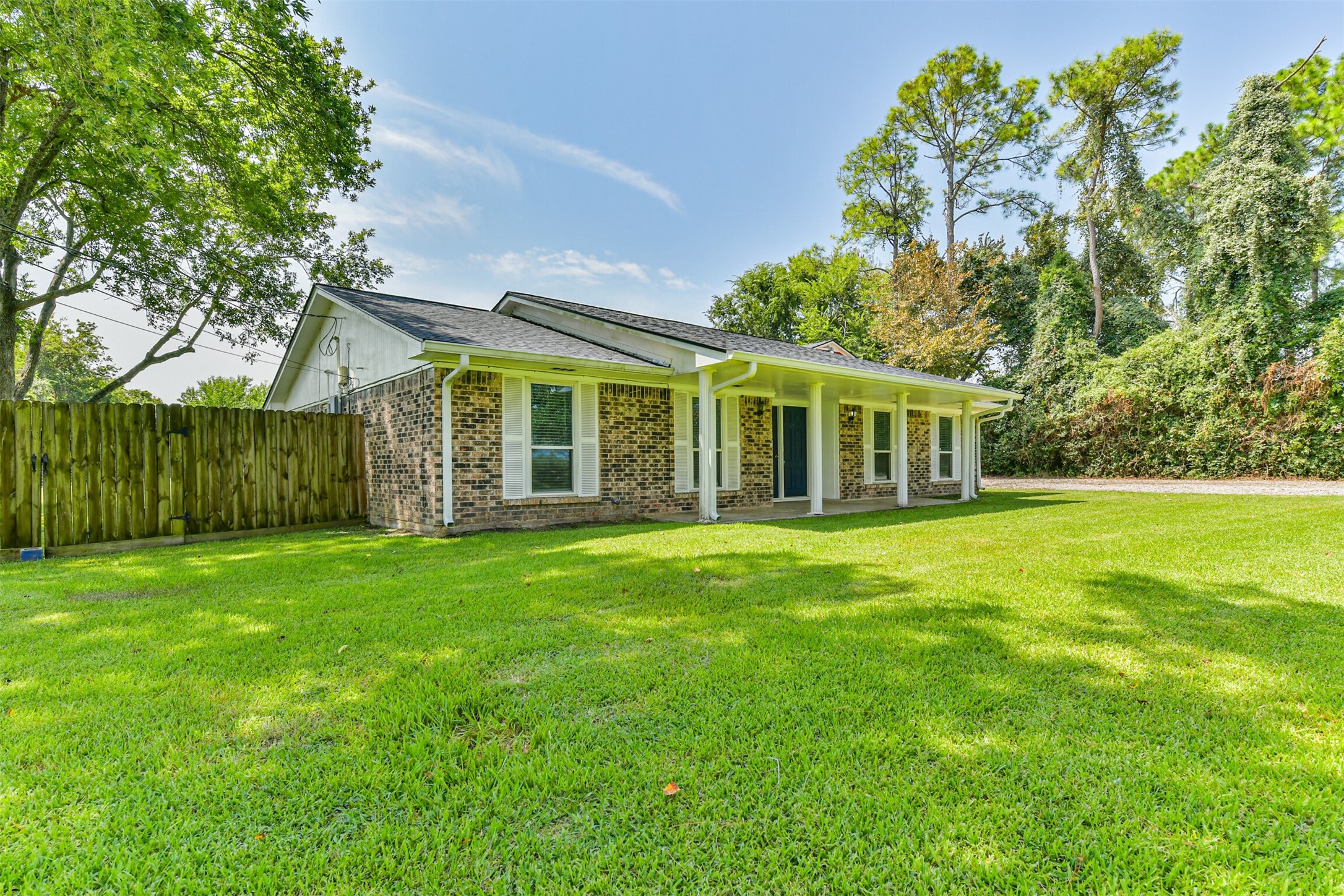 Discover your perfect retreat in this charming home, featuring a spacious yard and inviting porch. Enjoy serene living with lush surroundings. Welcome home!