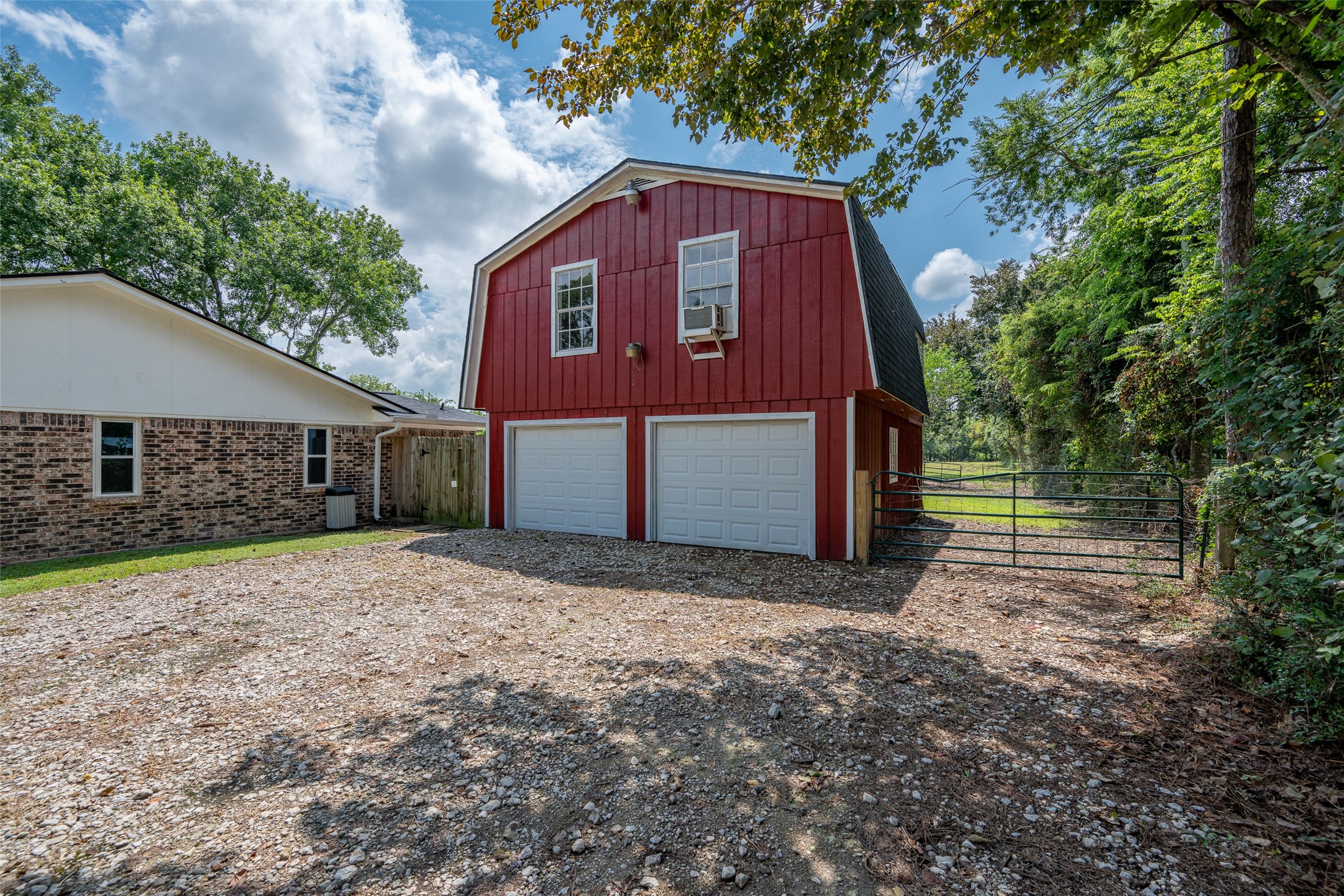 Garage with shop space and game room and sun room above