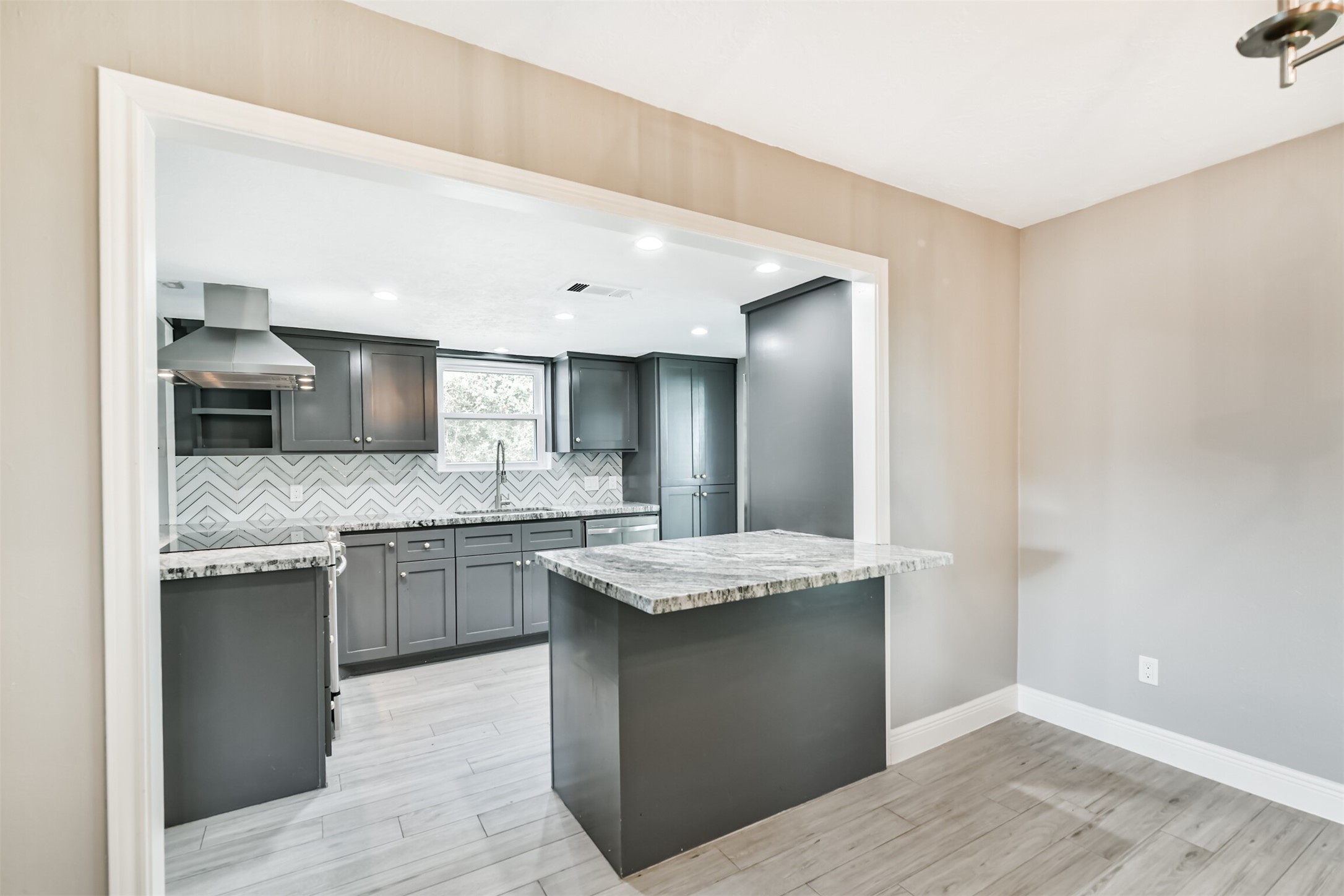 Cozy breakfast nook with easy kitchen access, perfect for morning gatherings.