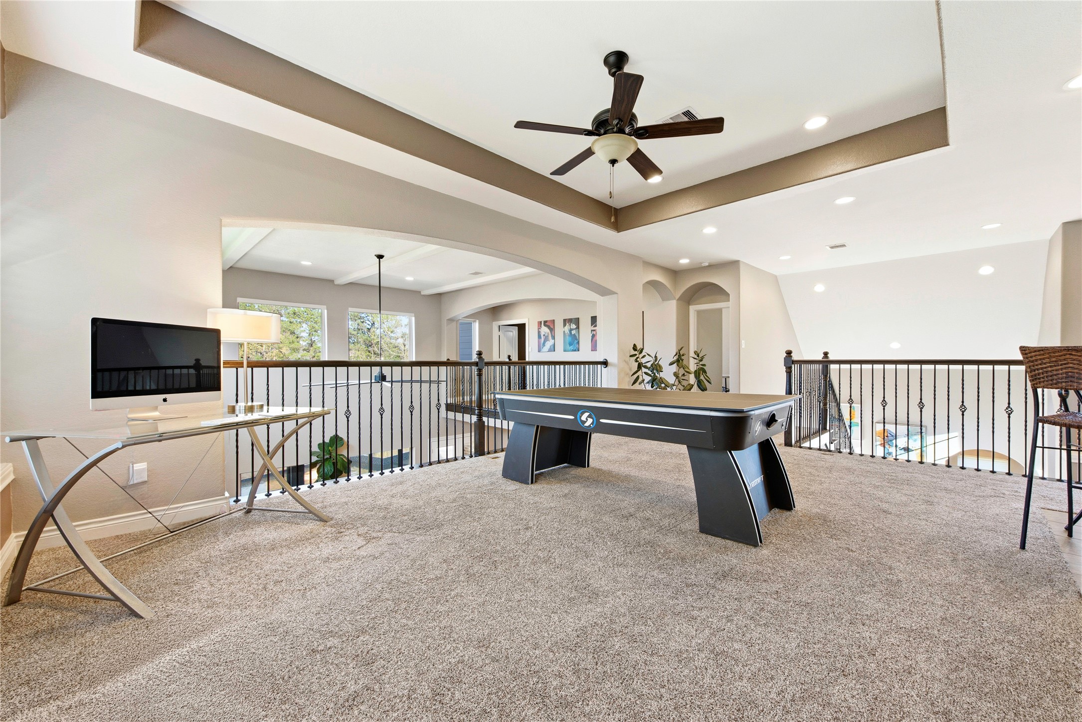 Huge game room with an open layout connecting to the first-floor living areas.