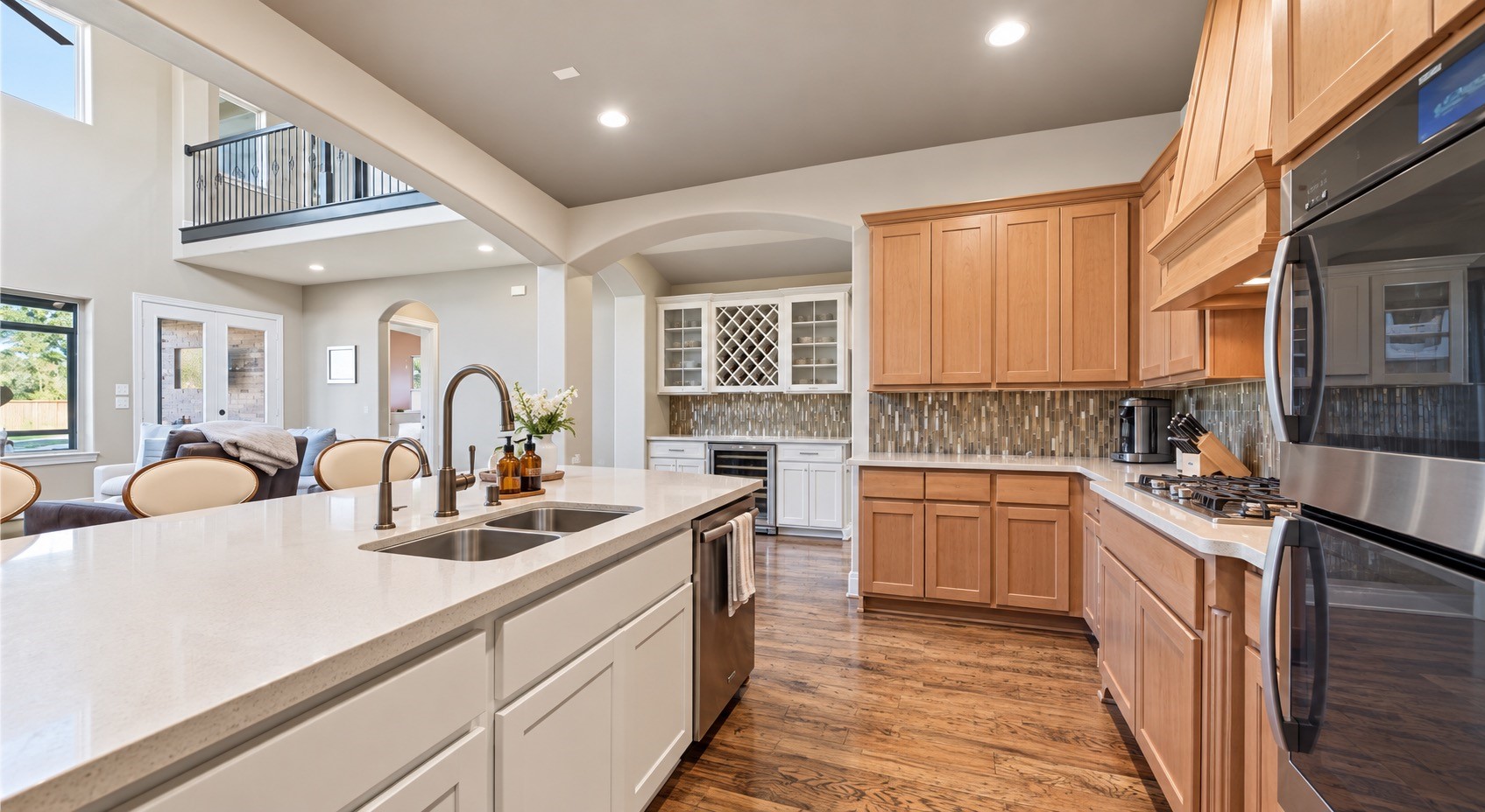 Kitchen showcasing abundant cabinetry, large center island and generous workspace.