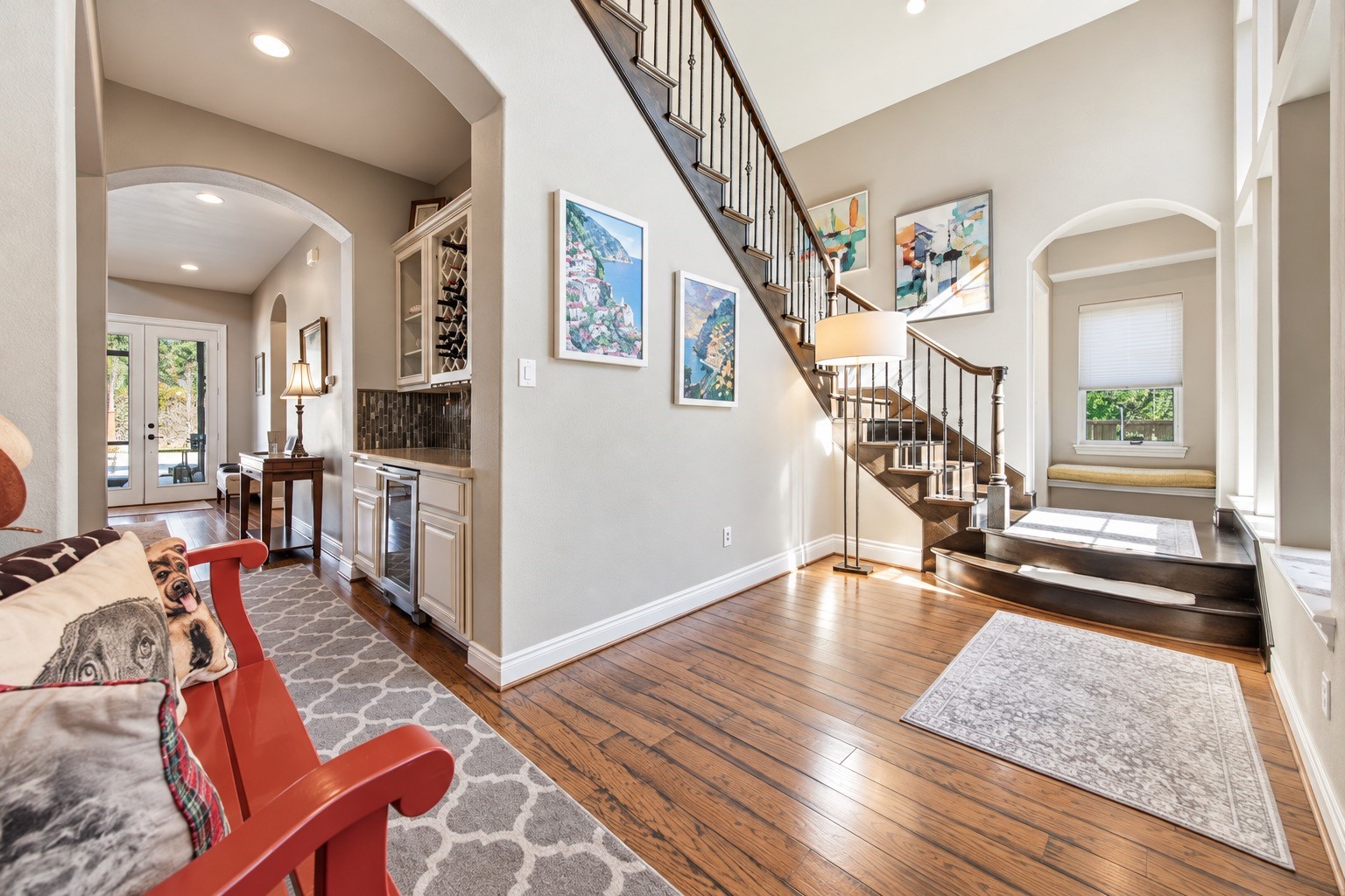 Open-concept interior showcasing the spacious living area, hardwood floors and architectural details.