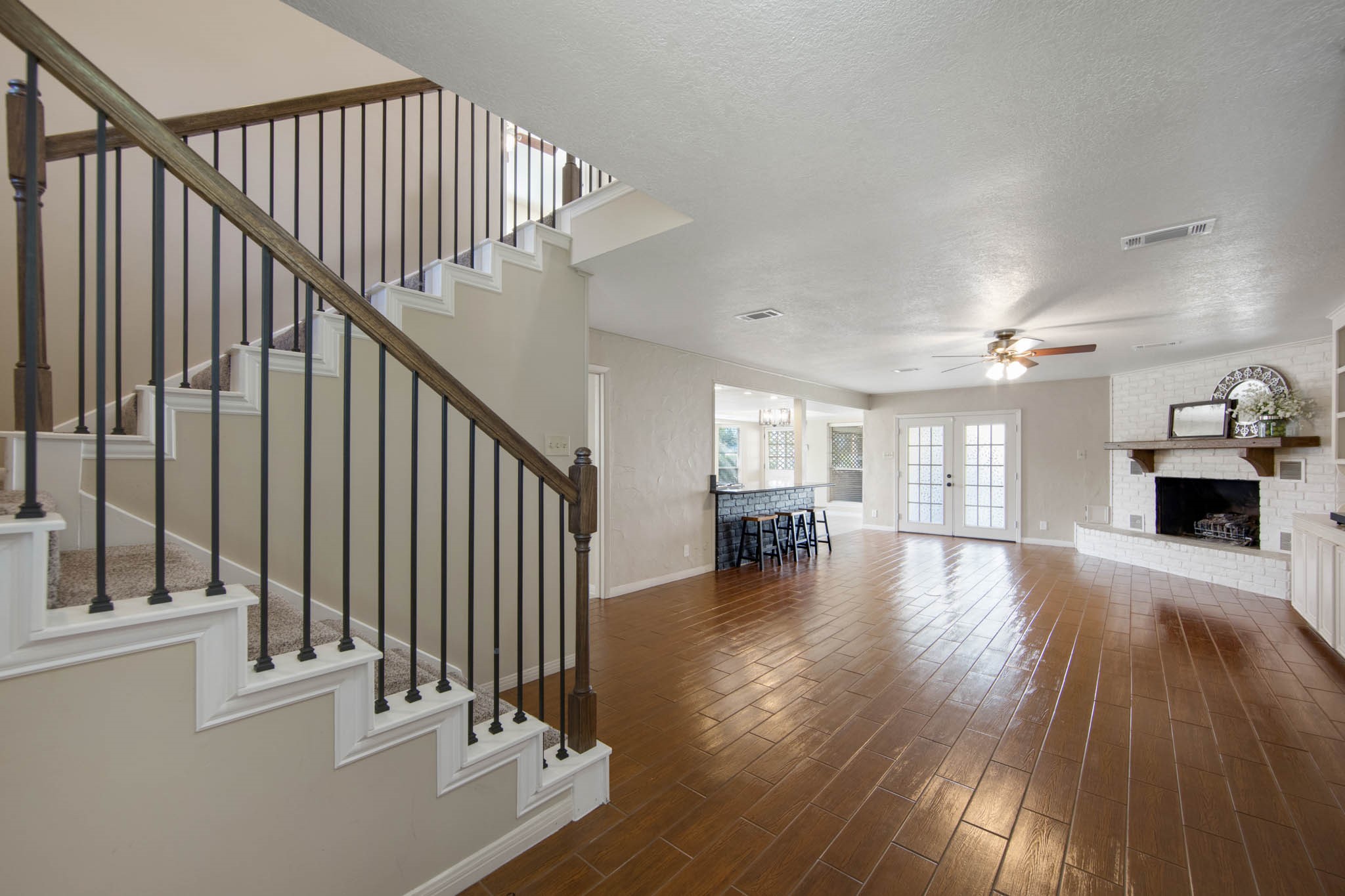 Living Room showing layout and stairwell leading to the 2nd floor
