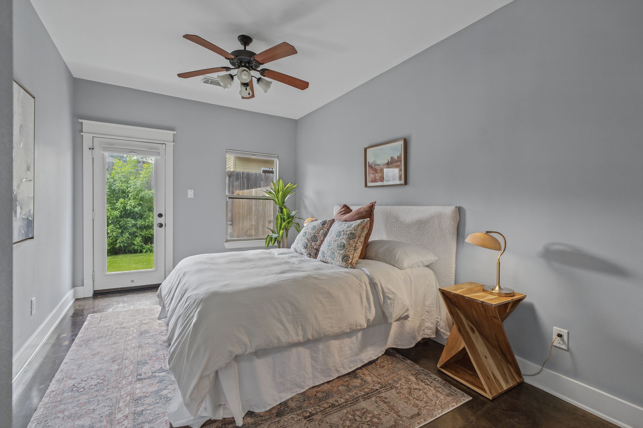 This first floor bedroom offers direct access to the private backyard. This first floor bedroom offers direct access to the private backyard.