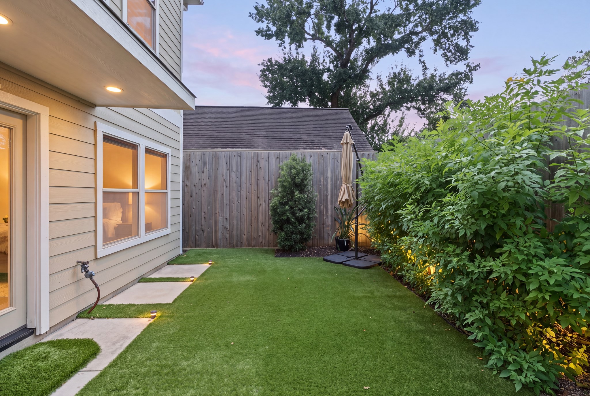 The private backyard features premium artificial turf installed in September 2024.