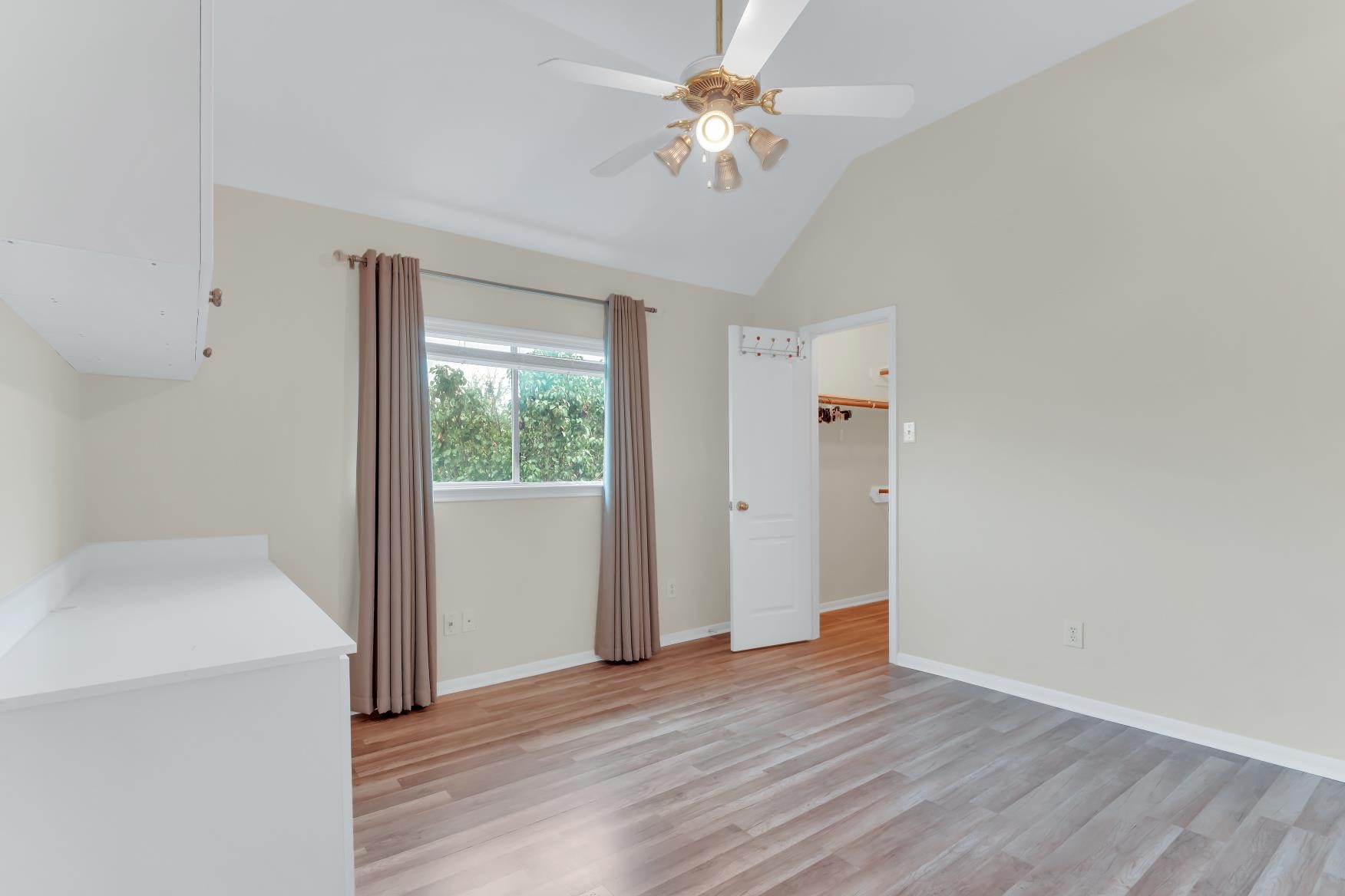 1st Bedroom, laminate flooring, ceiling fan.