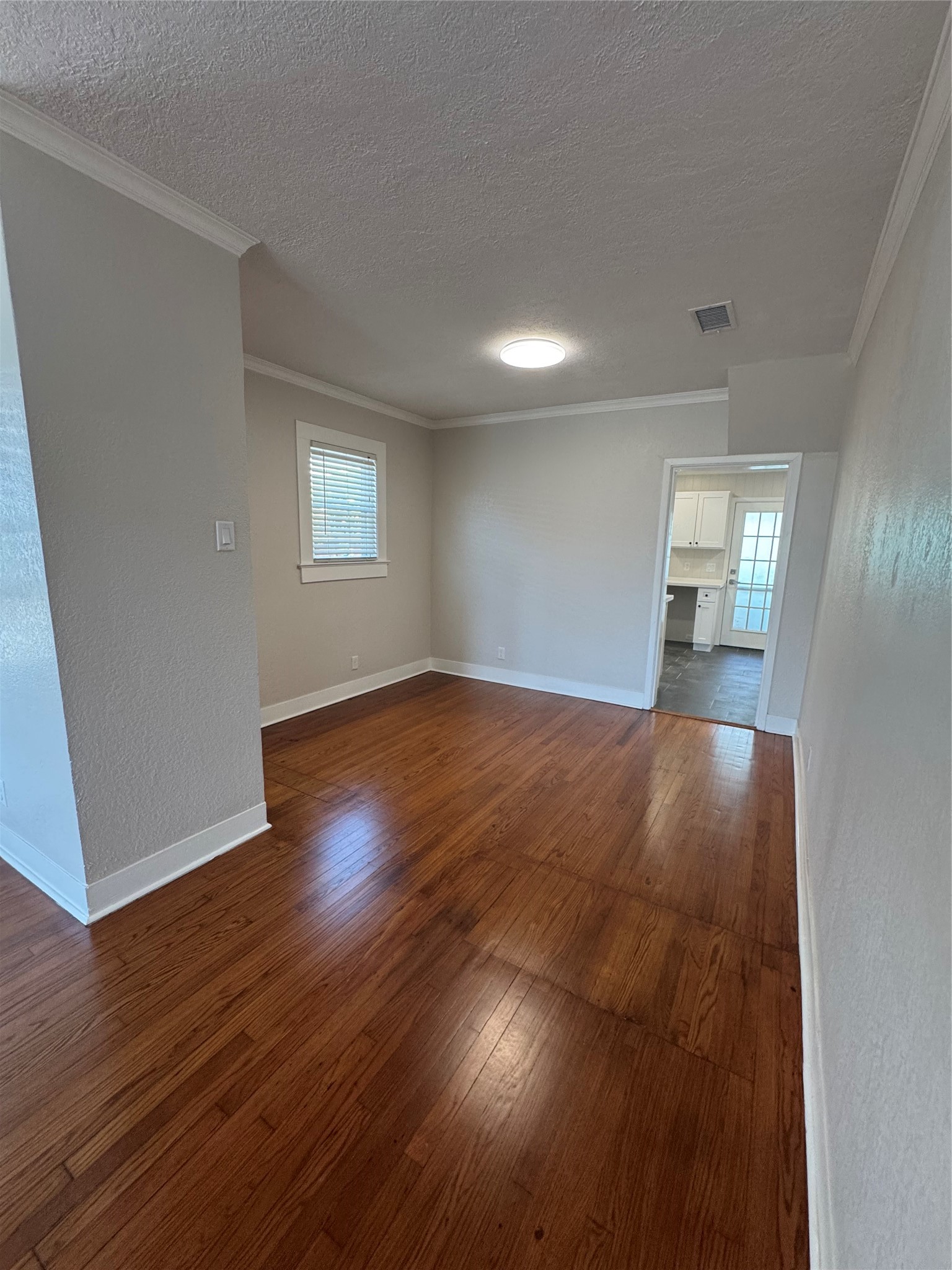 Dining room dining off of the living room. Could be an office or secondary living area.