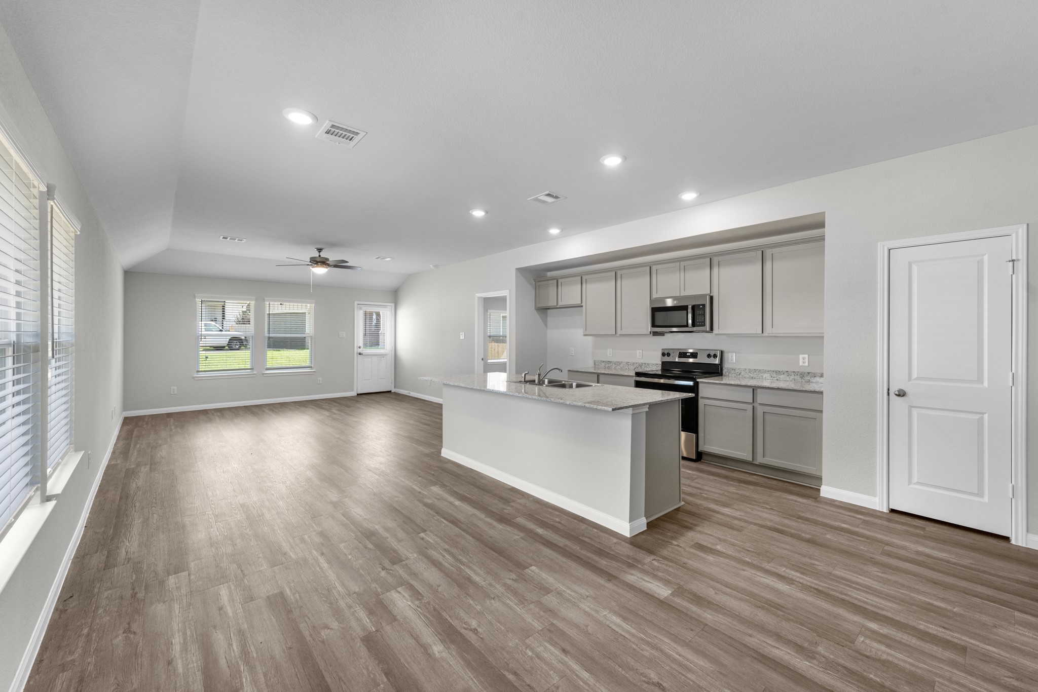Designed for entertaining, the kitchen is open to the casual dining and family room.