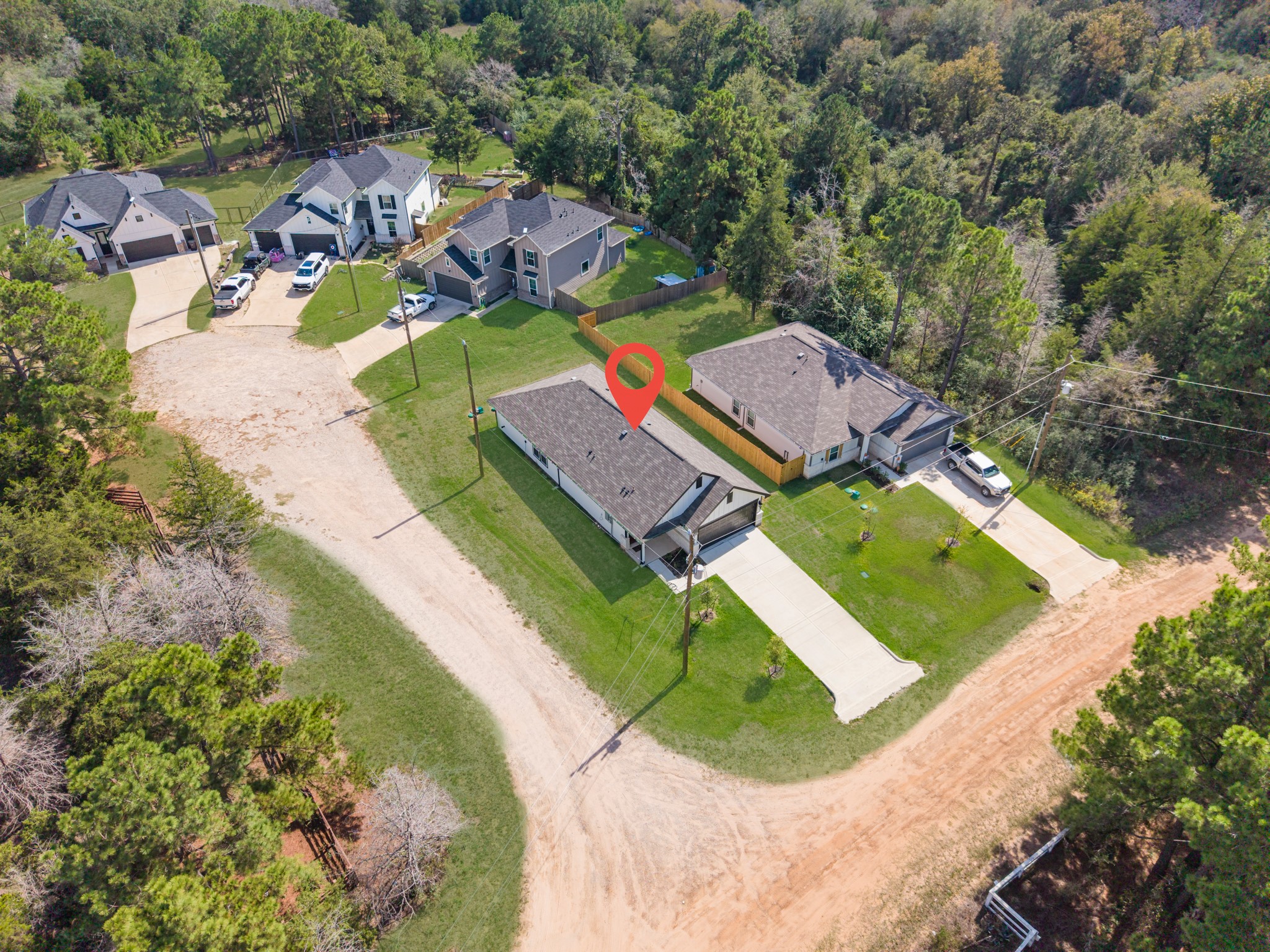Aerial view of the property showing the private corner lot situated near a quaint cul de sac.