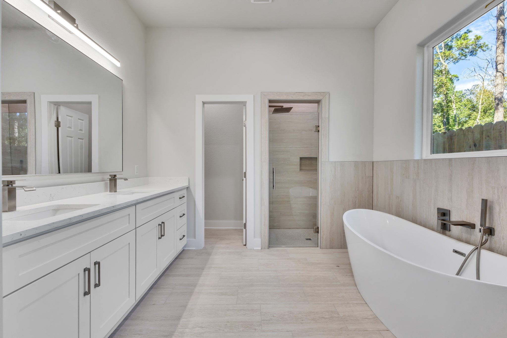 Primary Bathroom with Double Vanity and Freestanding Tub