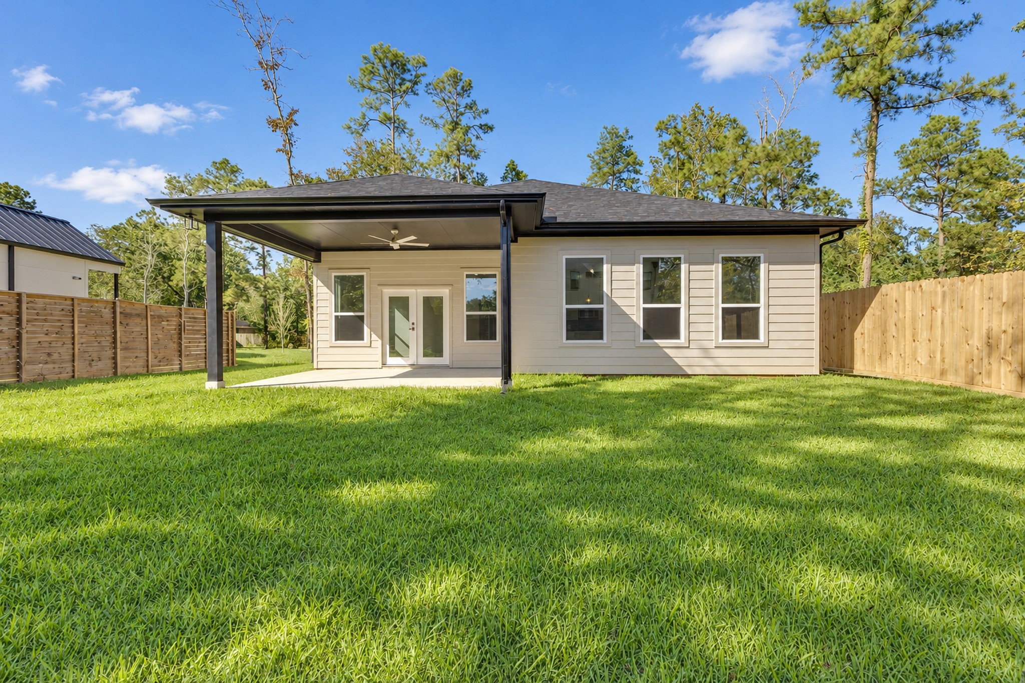 Rear Exterior View of the Home and Backyard