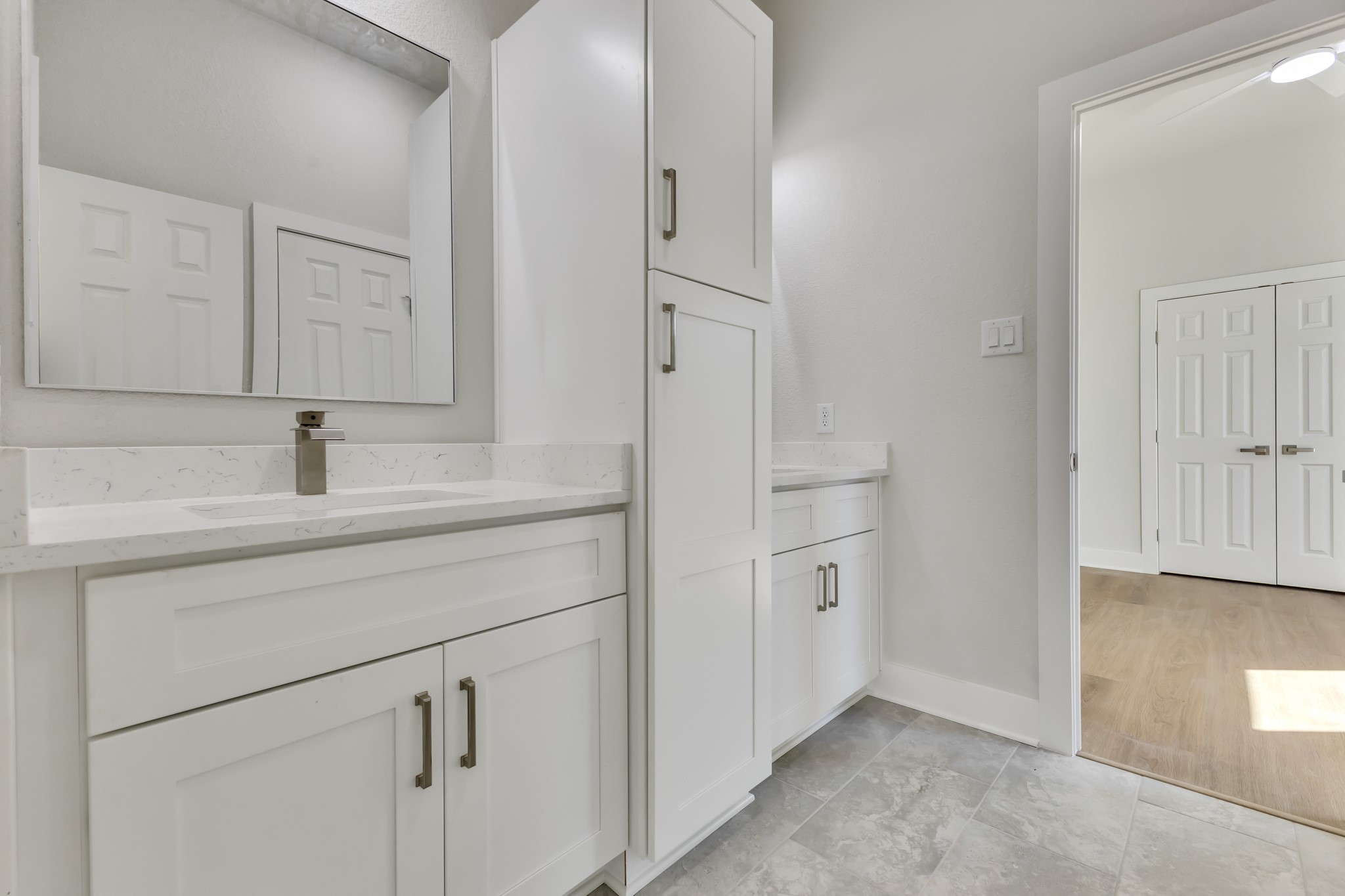 Shared Bathroom with Separate Vanities, Mirrors and Storage Cabinet