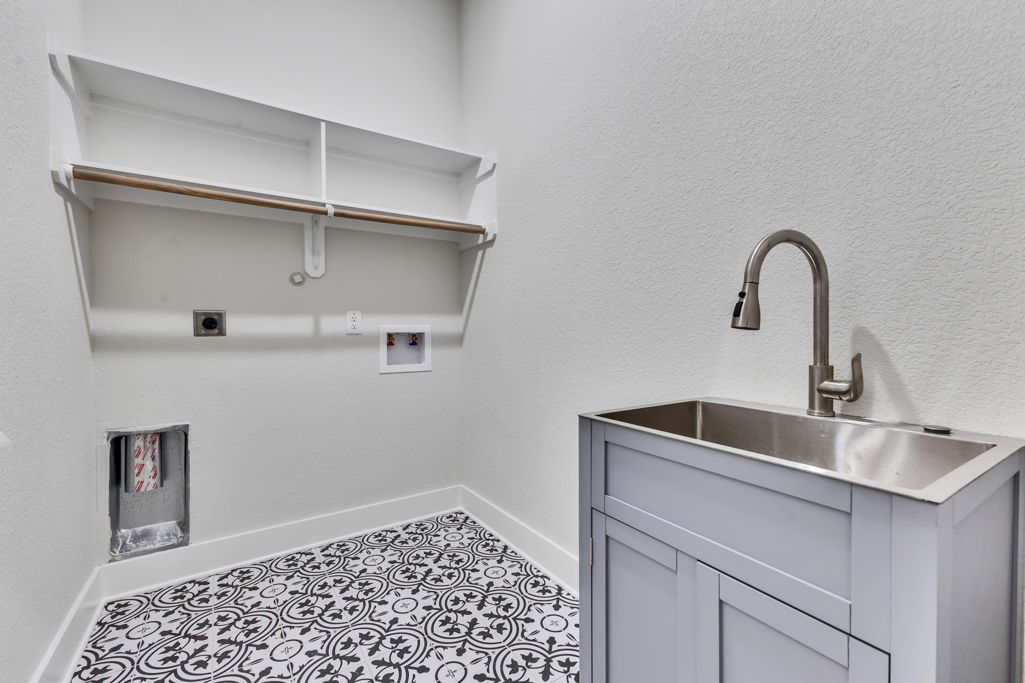 Utility Room with Built-In Cabinets and Sink