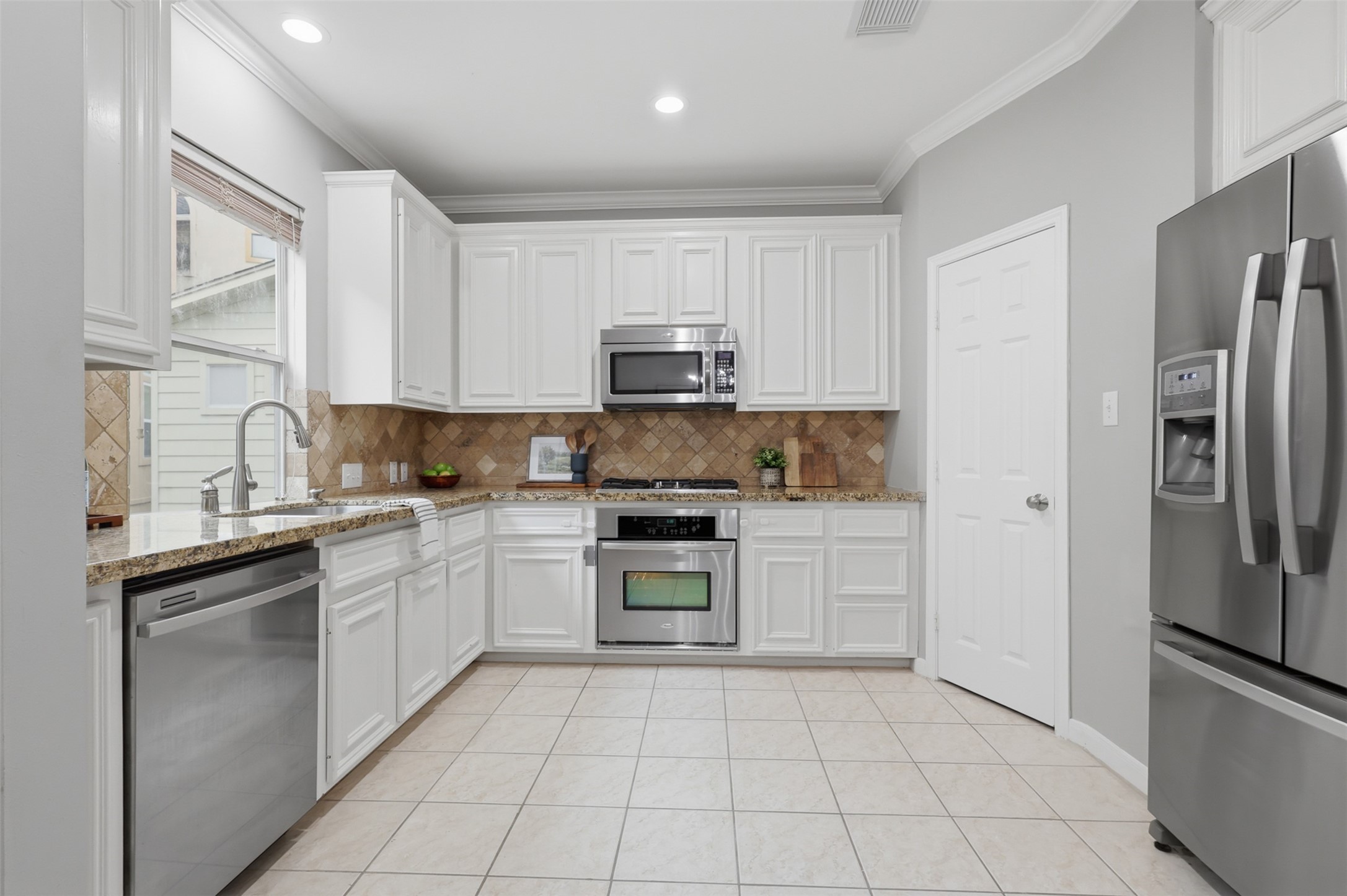 Kitchen with pantry and stainless steel appliances