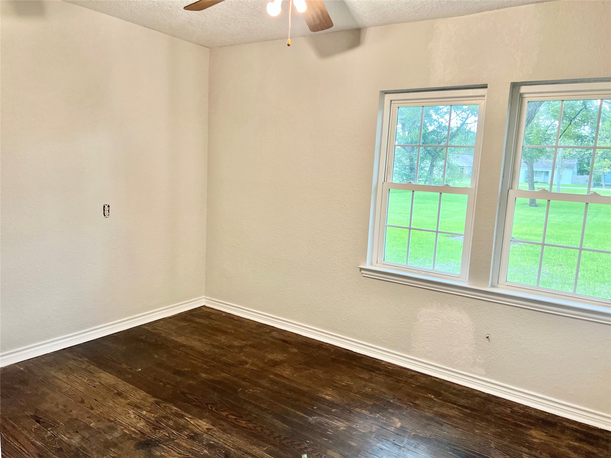 Hardwood flooring in one of the secondary bedrooms