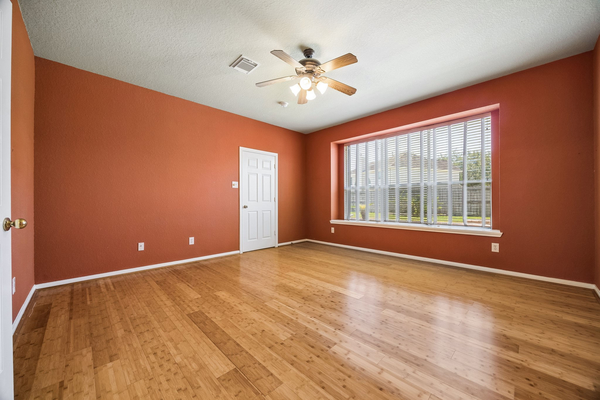 Comfort, space and privacy come together in this inviting primary suite with bamboo flooring, a deep walk-in closet and direct access to the updated ensuite bath.