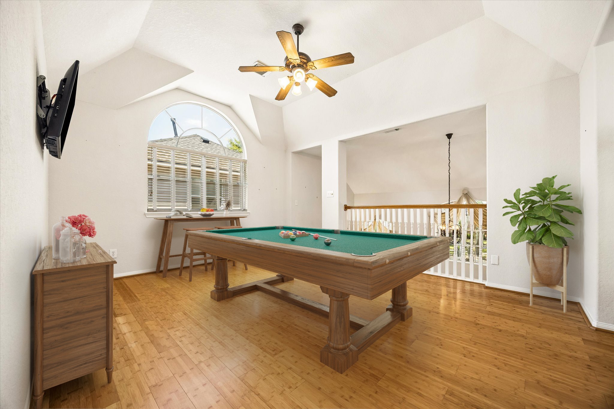 Bring your favorite games and make this flexible upstairs retreat your own. The roomy layout, vaulted ceiling, bamboo flooring and balcony overlook give you plenty of space for everything from a pool table to a cozy hangout zone.
