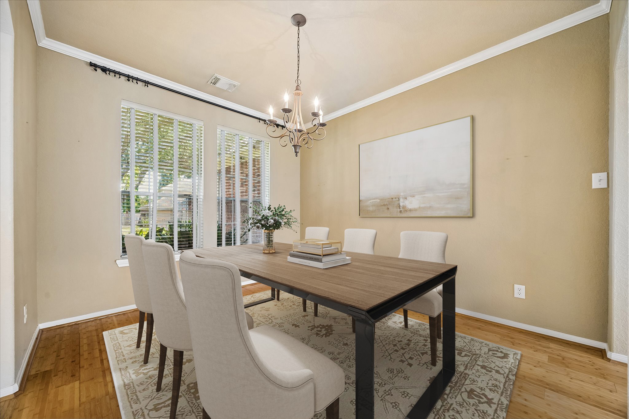 Another look at the formal dining room highlights the bamboo flooring, large windows with front yard views, elegant chandelier and classic details that make this a comfortable place to wine, dine and chat.