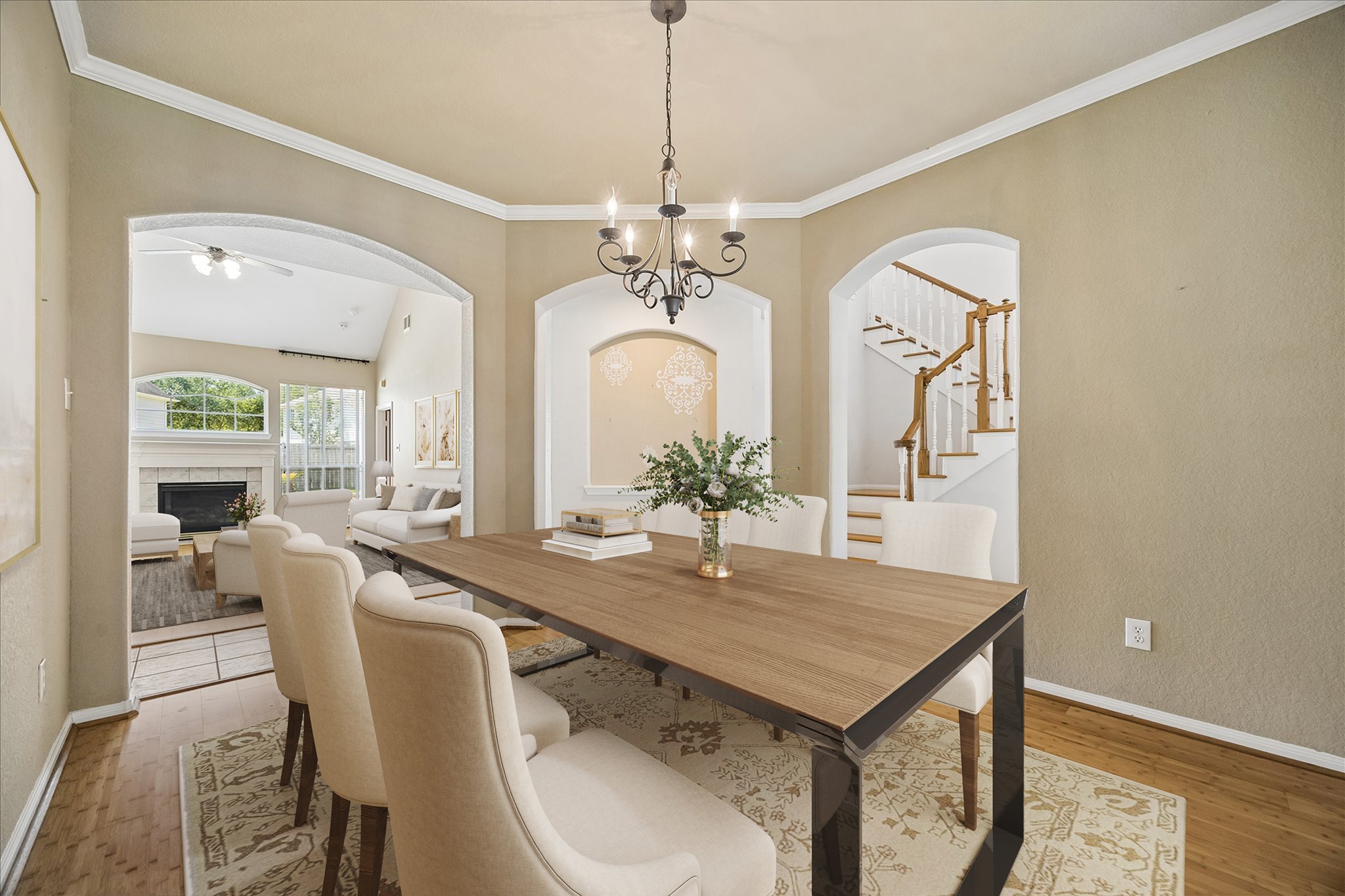 A welcoming formal dining room sets the stage for everything from candlelit dinners to lively holiday gatherings, with warm bamboo flooring, crown molding, abundant natural light and an easy connection to the kitchen and main living areas.
