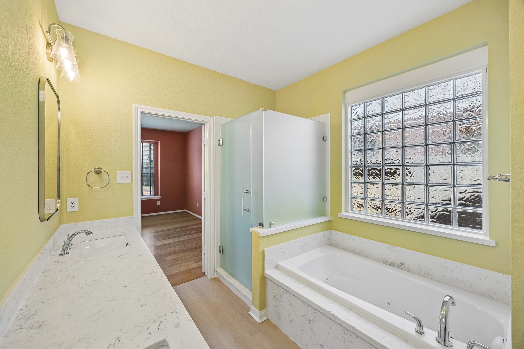 Enjoy a daily dose of luxury in this beautifully updated primary ensuite, where a 2025 renovation included a relaxing Jacuzzi tub, fresh finishes and a bright spa inspired feel.