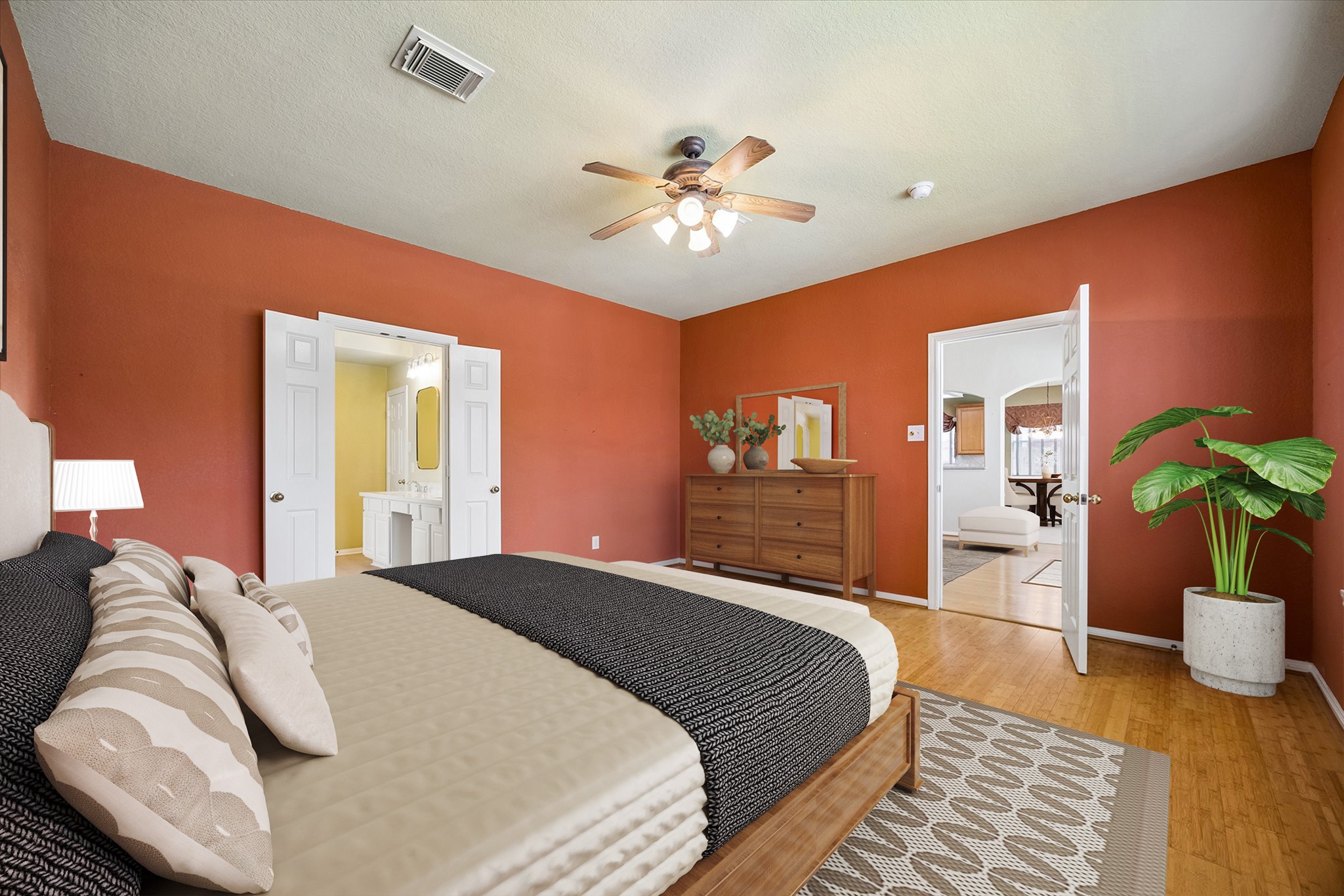 Tucked away on the first floor, the spacious primary suite offers a relaxing retreat with warm bamboo flooring, designer paint, a large walk-in closet, and private access to the spa inspired ensuite.