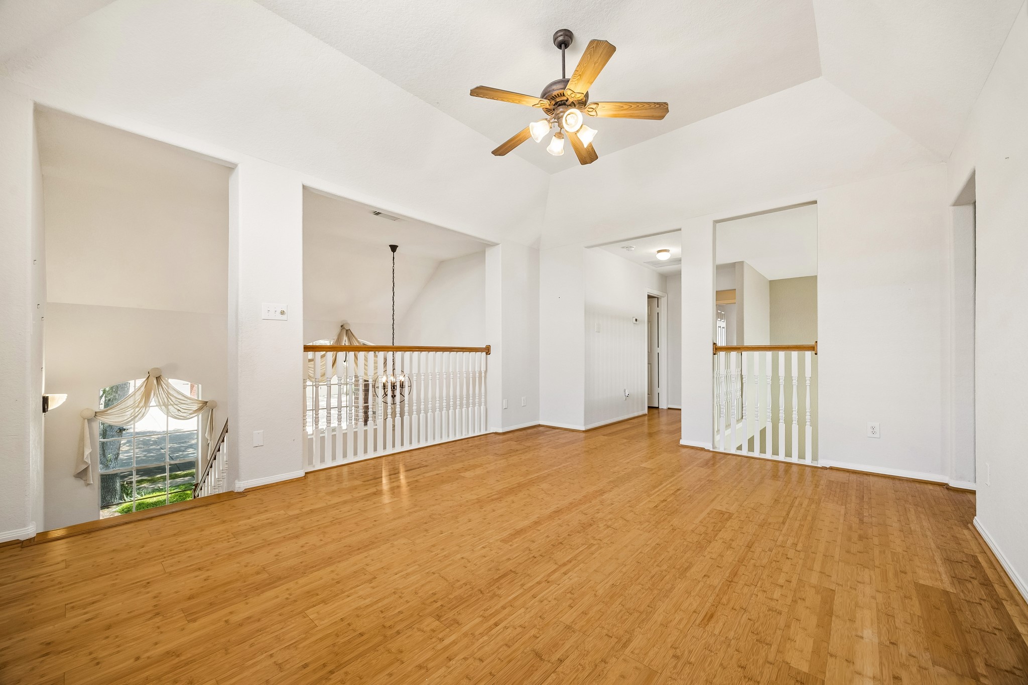 The open loft design keeps this spacious game room connected to the action below, while bamboo flooring, a vaulted ceiling and abundant natural light create an inviting place to kick back and have some fun.
