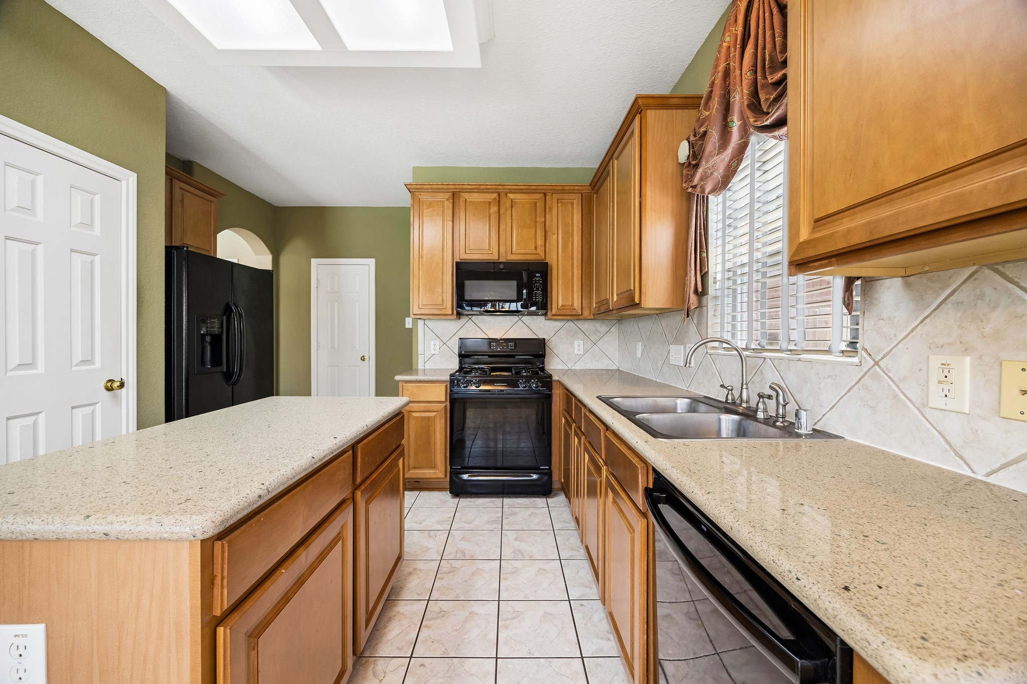Cook, serve and stay connected in a kitchen that offers long stretches of quartz countertops along with a convenient center island. Theres plenty of room to prep, serve and clean up, with abundant cabinetry keeping everyday essentials close at hand.