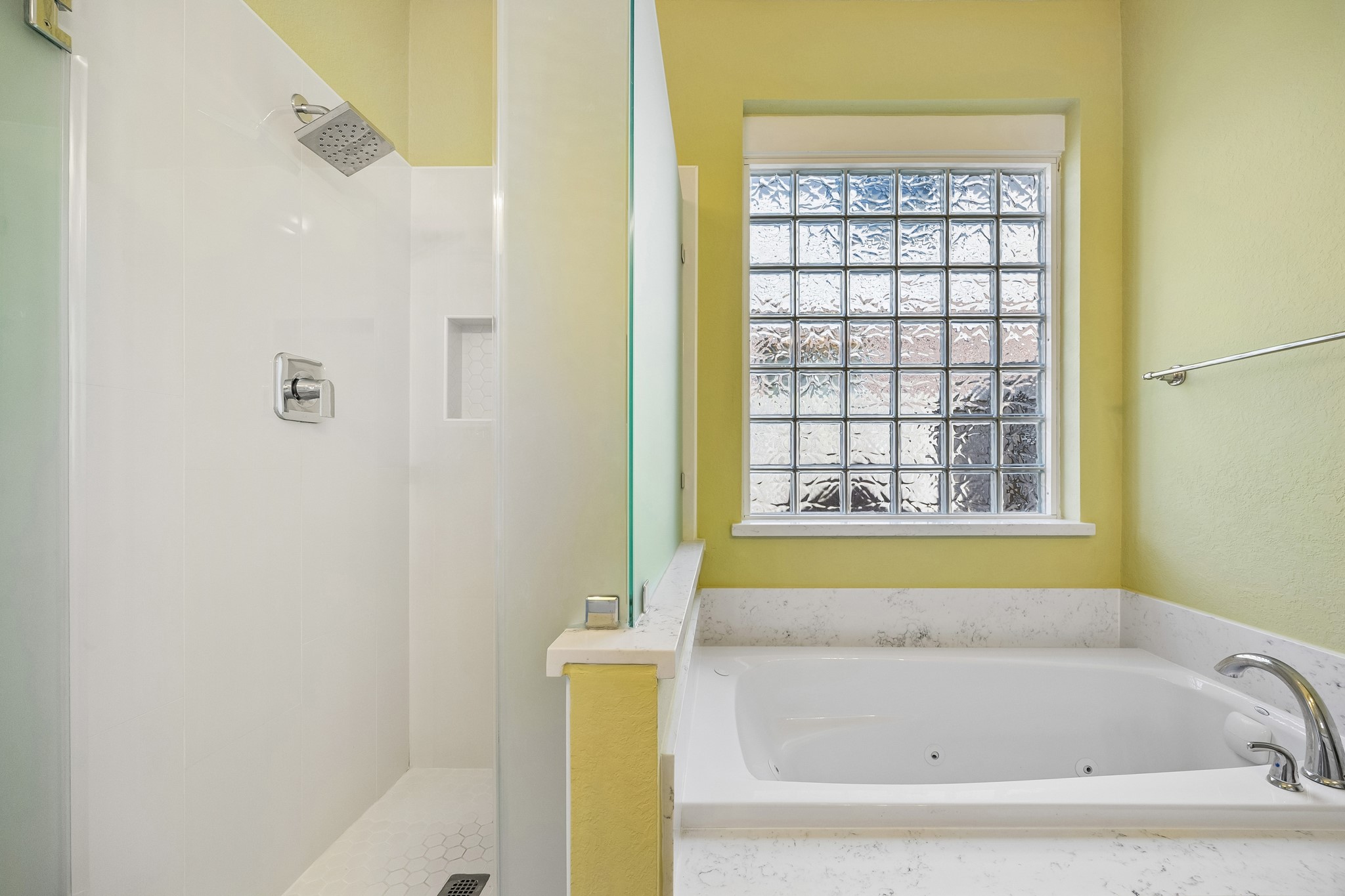 Soak away the day in the deep jetted tub or refresh in the separate walk-in shower with frosted glass and sleek fixtures. Either way, you're going to love this relaxing private retreat.
