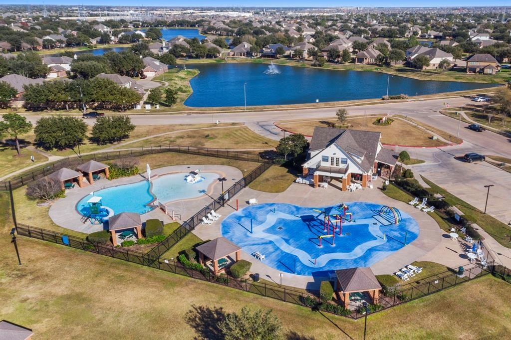 Discover a vibrant community oasis featuring a refreshing pool and exciting splashpad, perfect for family fun and relaxation amidst scenic surroundings.