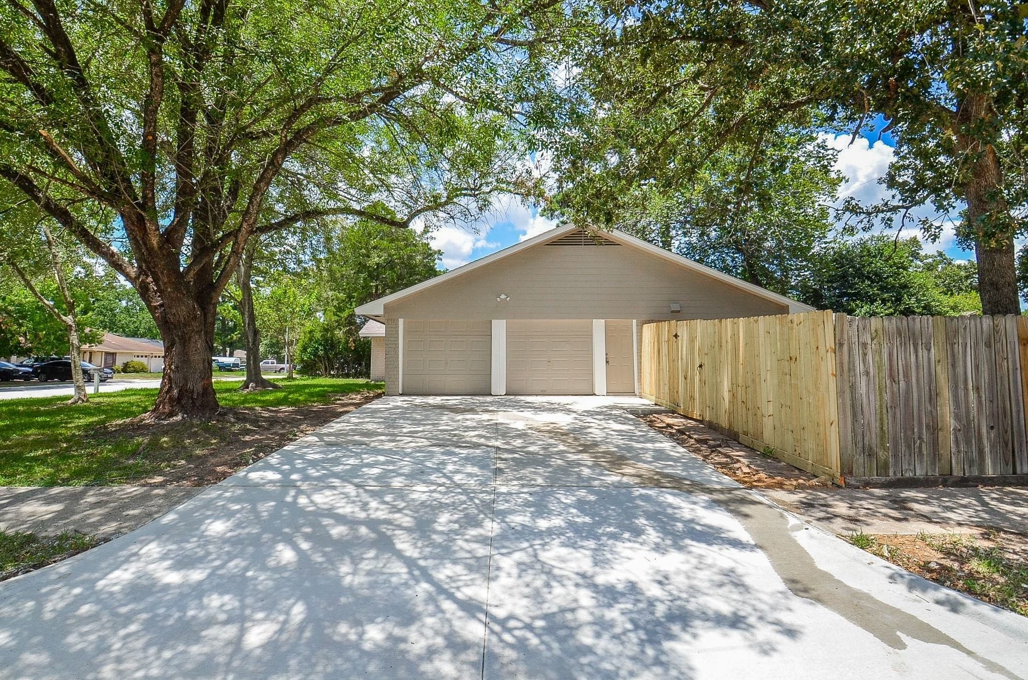 Welcome to your new home! This spacious driveway is located on the side of the house, allowing ample front yard space and an abundance of parking.