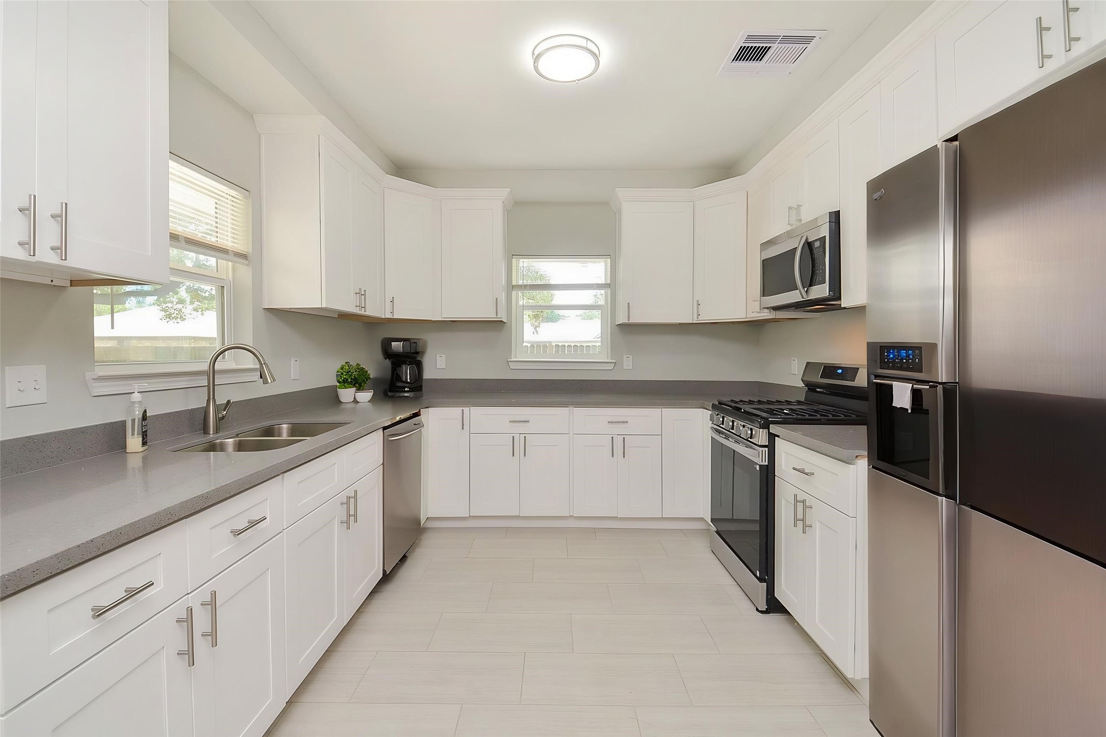 Photos are staged for marketing purposes. Refrigerator is not included and is not present in the home.