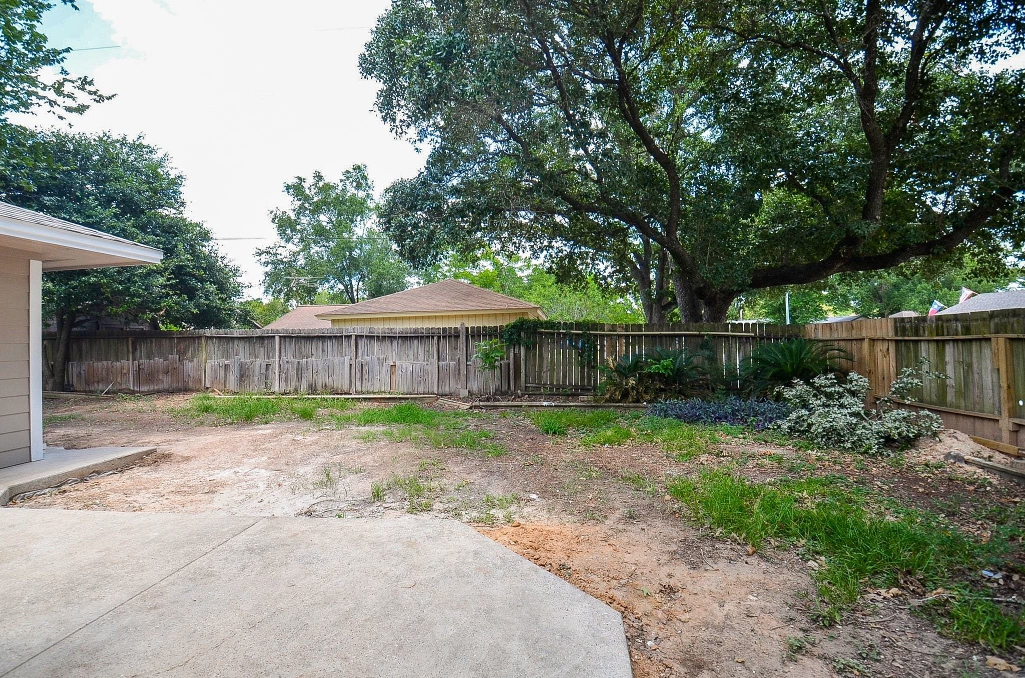 Discover this spacious backyard. Perfect for relaxing in the shade or entertaining.