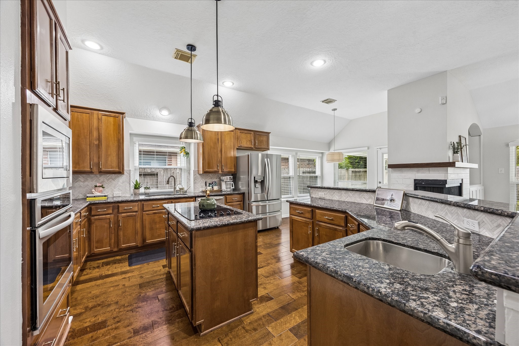 Where style meets functionality! Thoughtfully refreshed in 2024, this inviting kitchen features upgraded tile backsplash, stylish hardware, new appliances, and recessed lighting. Beautiful finishes and thoughtful improvements make this space a pleasure to cook and gather in!