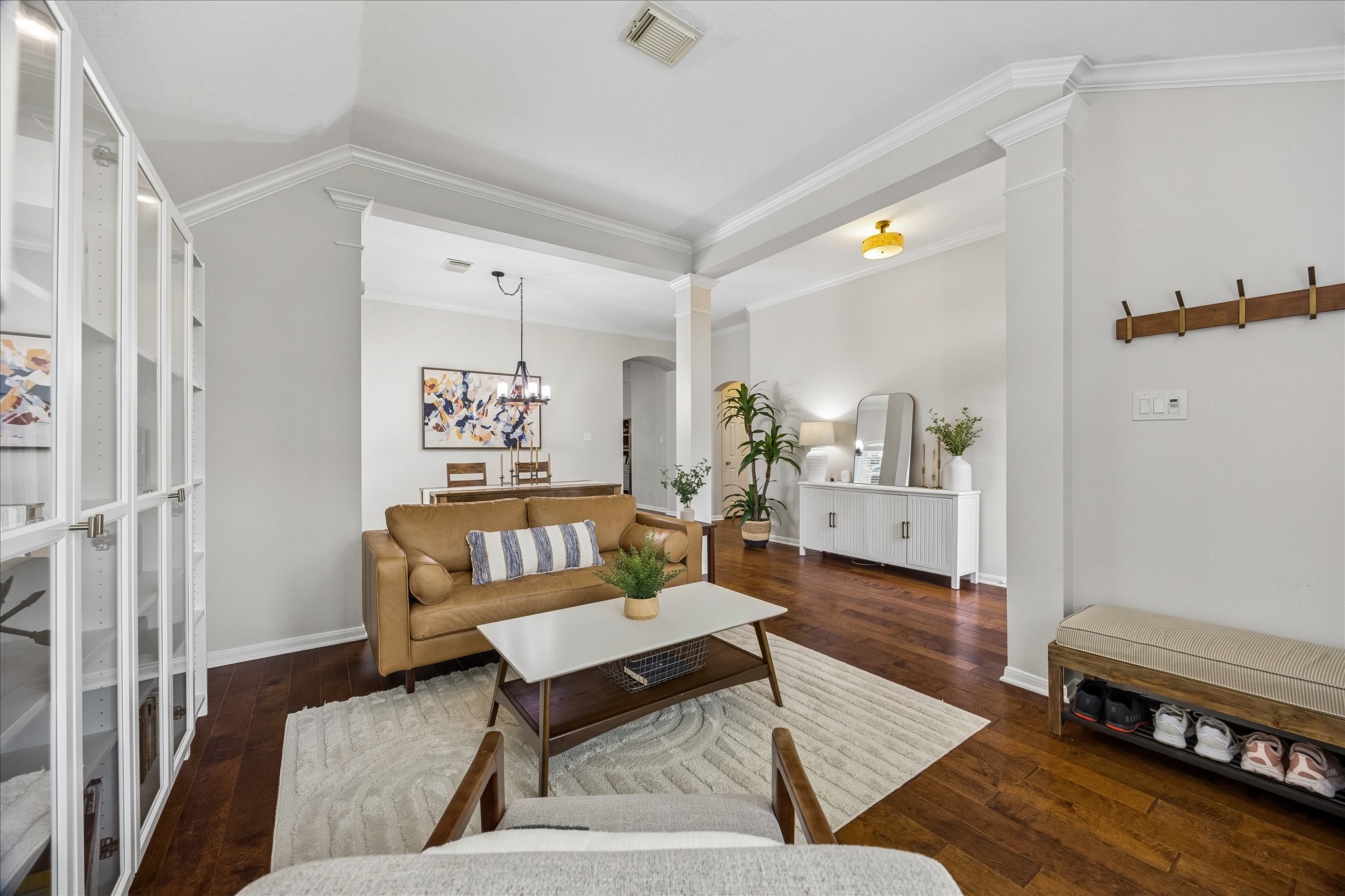 Beautifully designed for both entertaining and everyday living! This inviting space offers a versatile layout, elegant architectural detailing, and seamless flow into the adjoining dining areaperfect for gathering with family and friends.