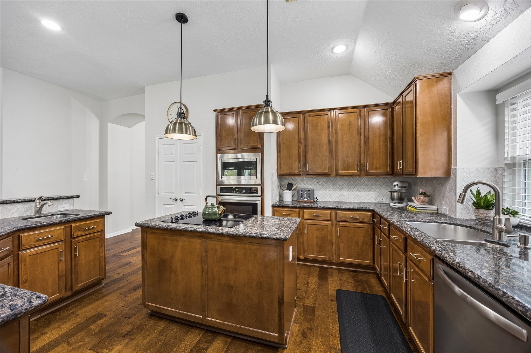A kitchen that makes everyday living effortless! Generous counter space, abundant cabinetry, and a thoughtfully arranged workspace offer the perfect combination of practicality and charm.