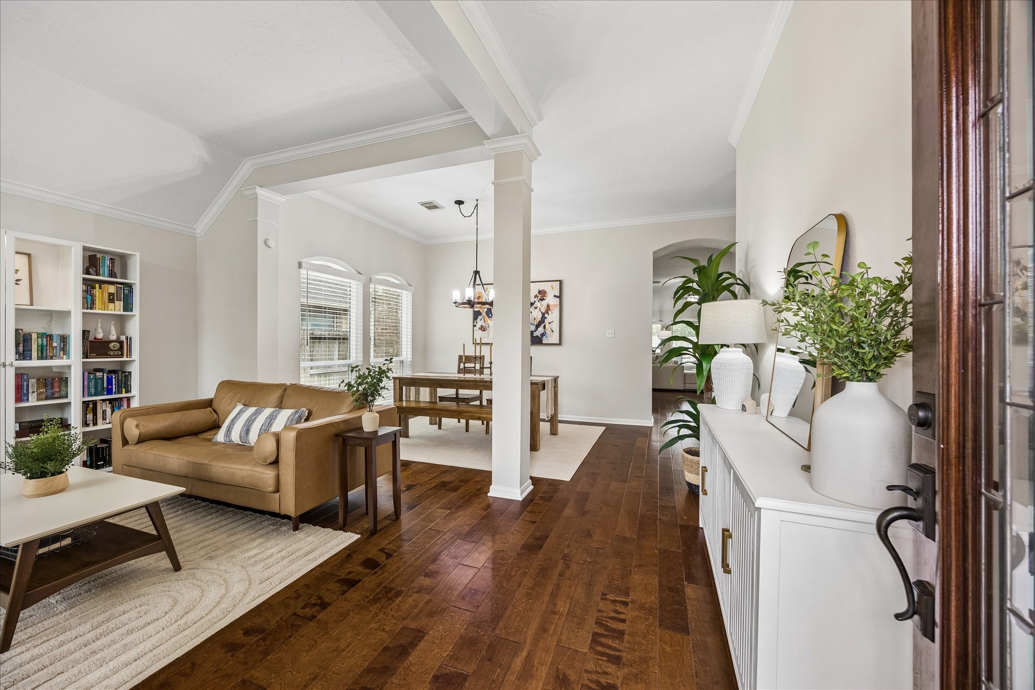 Step inside and feel right at home! Beautiful architectural details, rich wood flooring, and an inviting open design create a graceful transition into the homes thoughtfully updated living spaces.