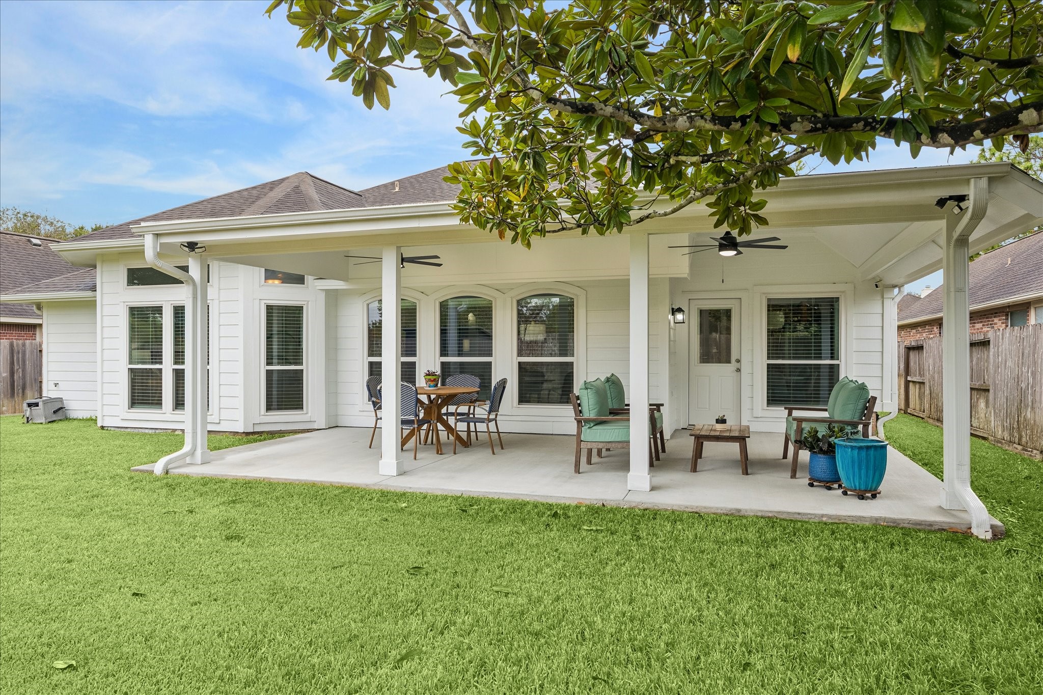 Room to relax, play, and enjoy the outdoors! The beautifully maintained backyard offers an inviting stretch of green space with endless possibilities for outdoor activities, gardening, or simply soaking up the sunshine.