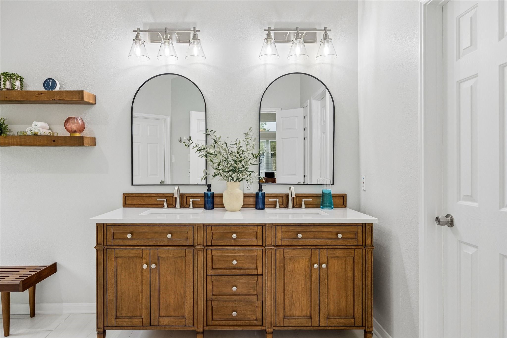 Luxury is in the details! This second view highlights the beautifully updated vanity area, featuring elegant quartz countertops, new cabinetry, stylish fixtures, and thoughtfully selected finishes from the homes extensive 2024 renovation.