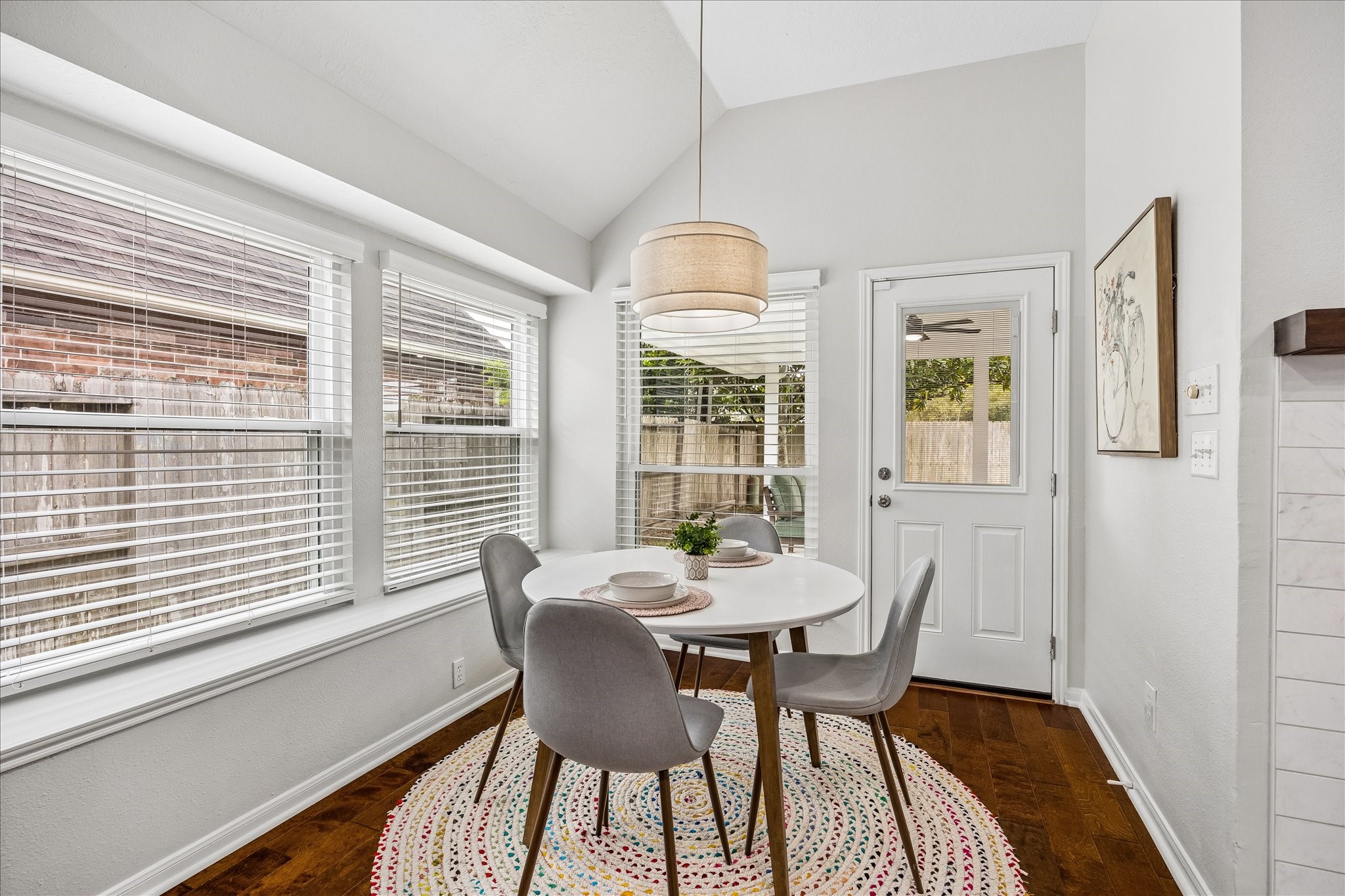 Start your mornings surrounded by natural light! This charming breakfast area offers a cozy spot for casual dining, with lovely backyard views and an inviting connection to the kitchen. The perfect place to enjoy your morning coffee!