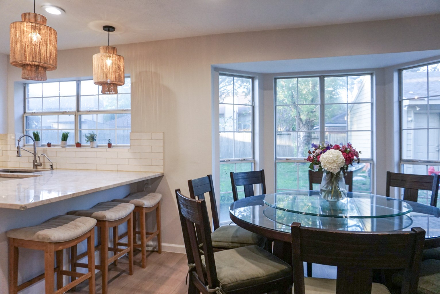 Dining Room open to Kitchen, accompanied by large bay windows