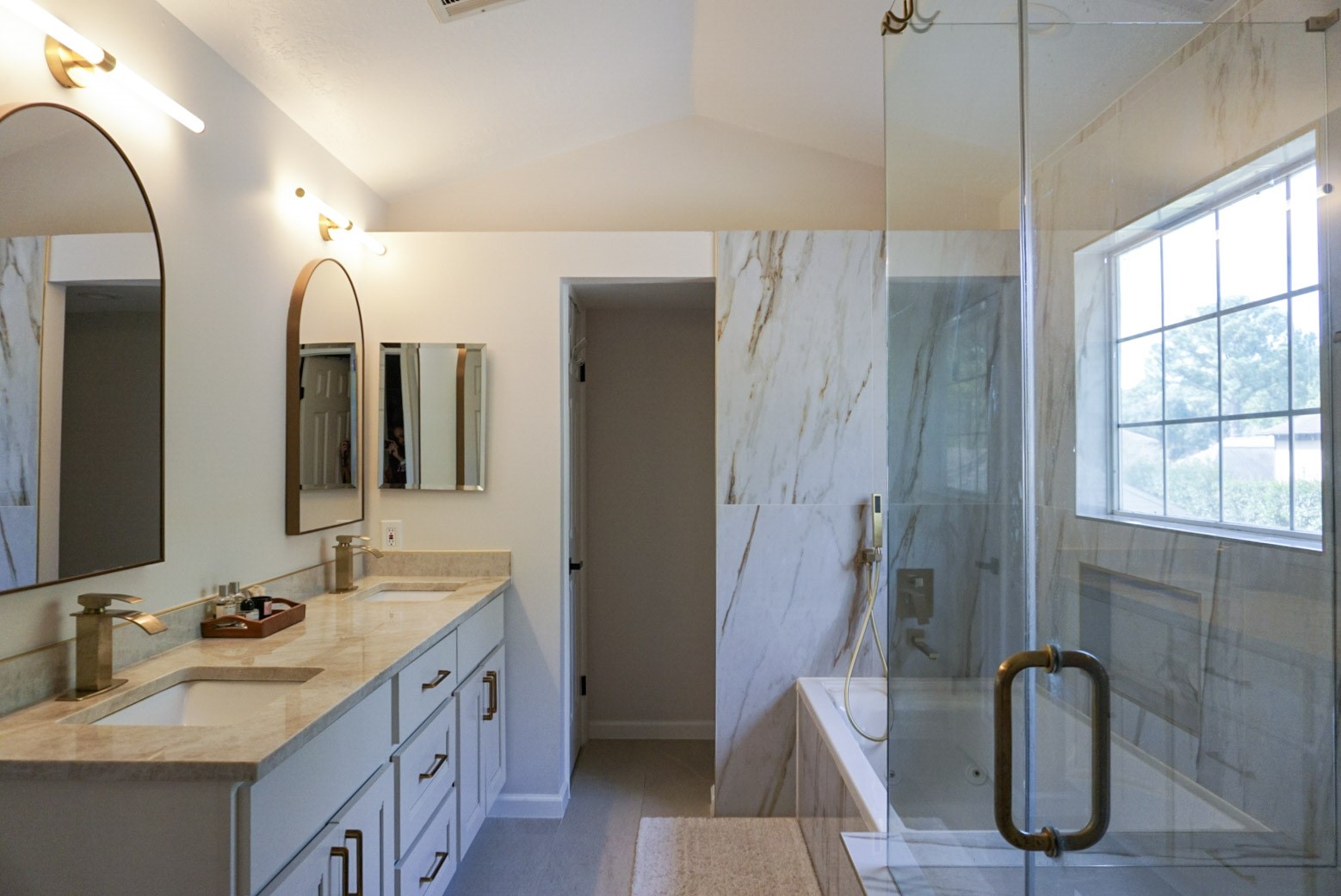 Primary bathroom with separate shower/tub, double vanity sink, jetted tub
