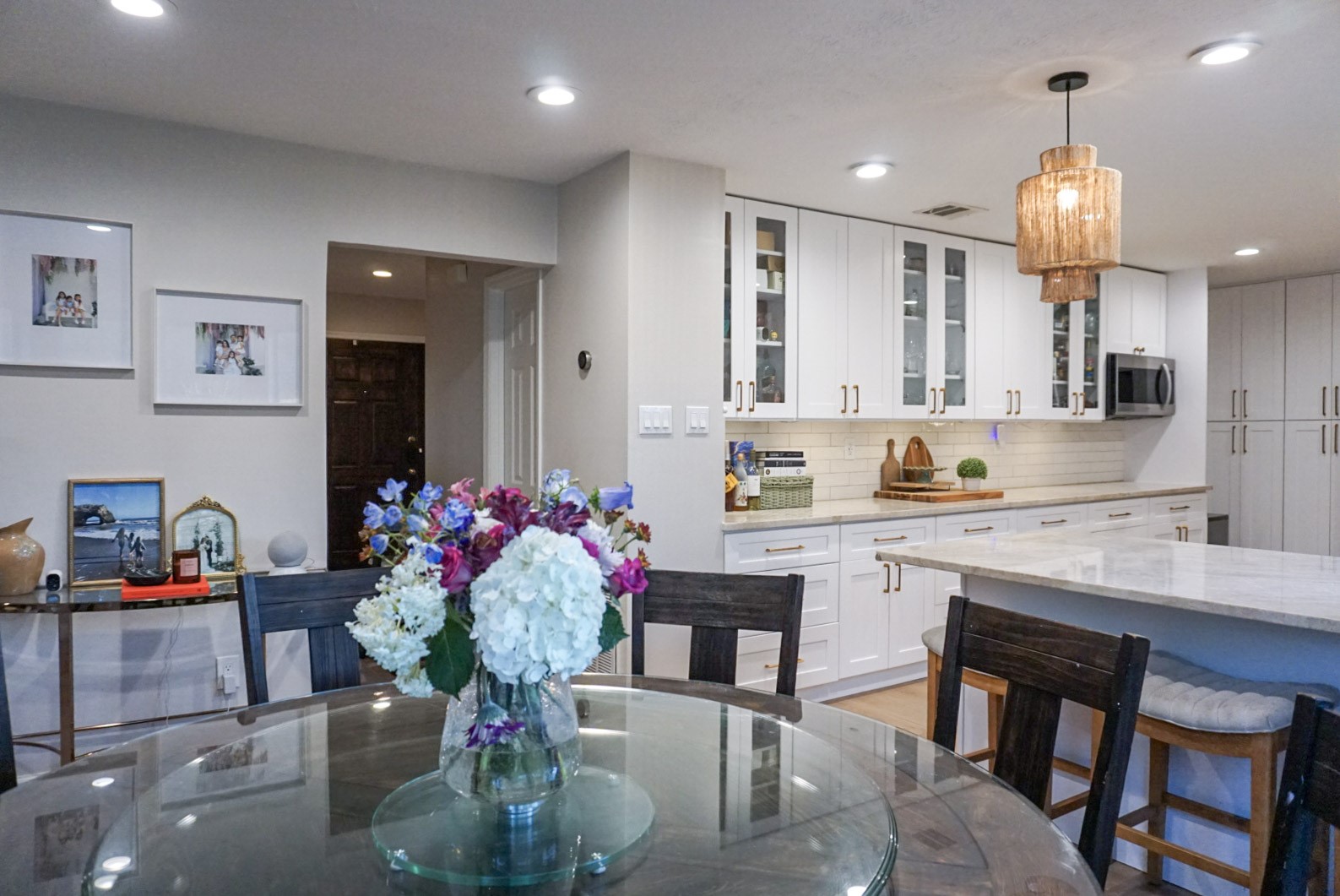 Another angle of Dining/Kitchen combo; angle showing hallway to the front of the home/half bath