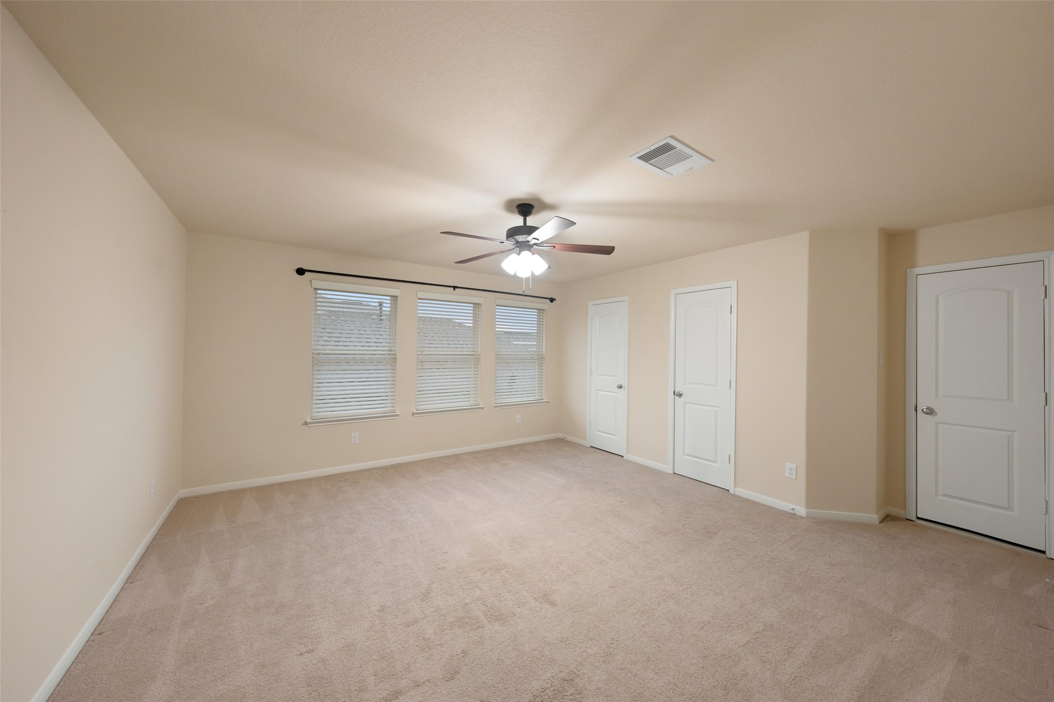 Huge upstairs bedroom. Could easily be a second primary bedroom, with bathroom access just off the hall. Notice the full size door next to the closet. It leads a fully outfitted attic with space galore!