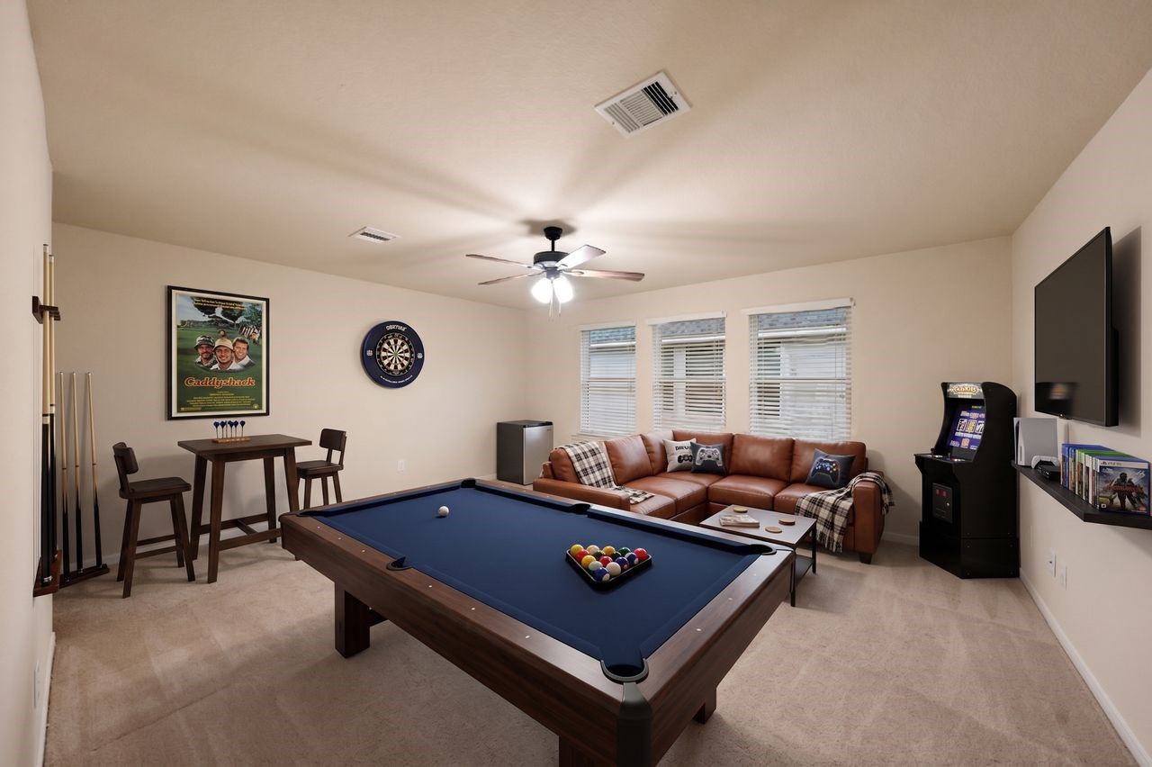 Game room can easily fit a sitting area along with pool table or any kind of gaming or crafting table.
