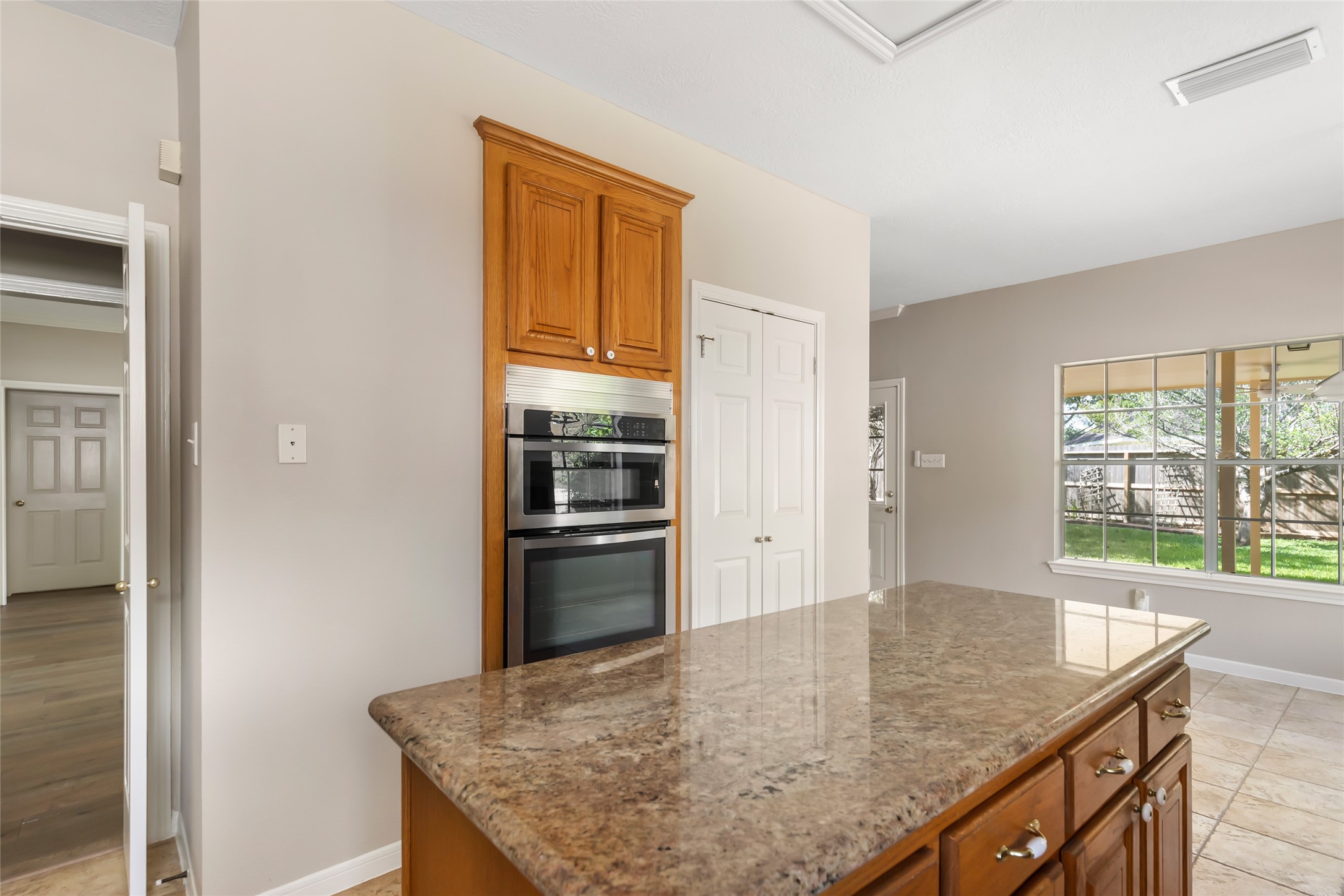 Kitchen island provides additional cooking space and additional cabinetry
