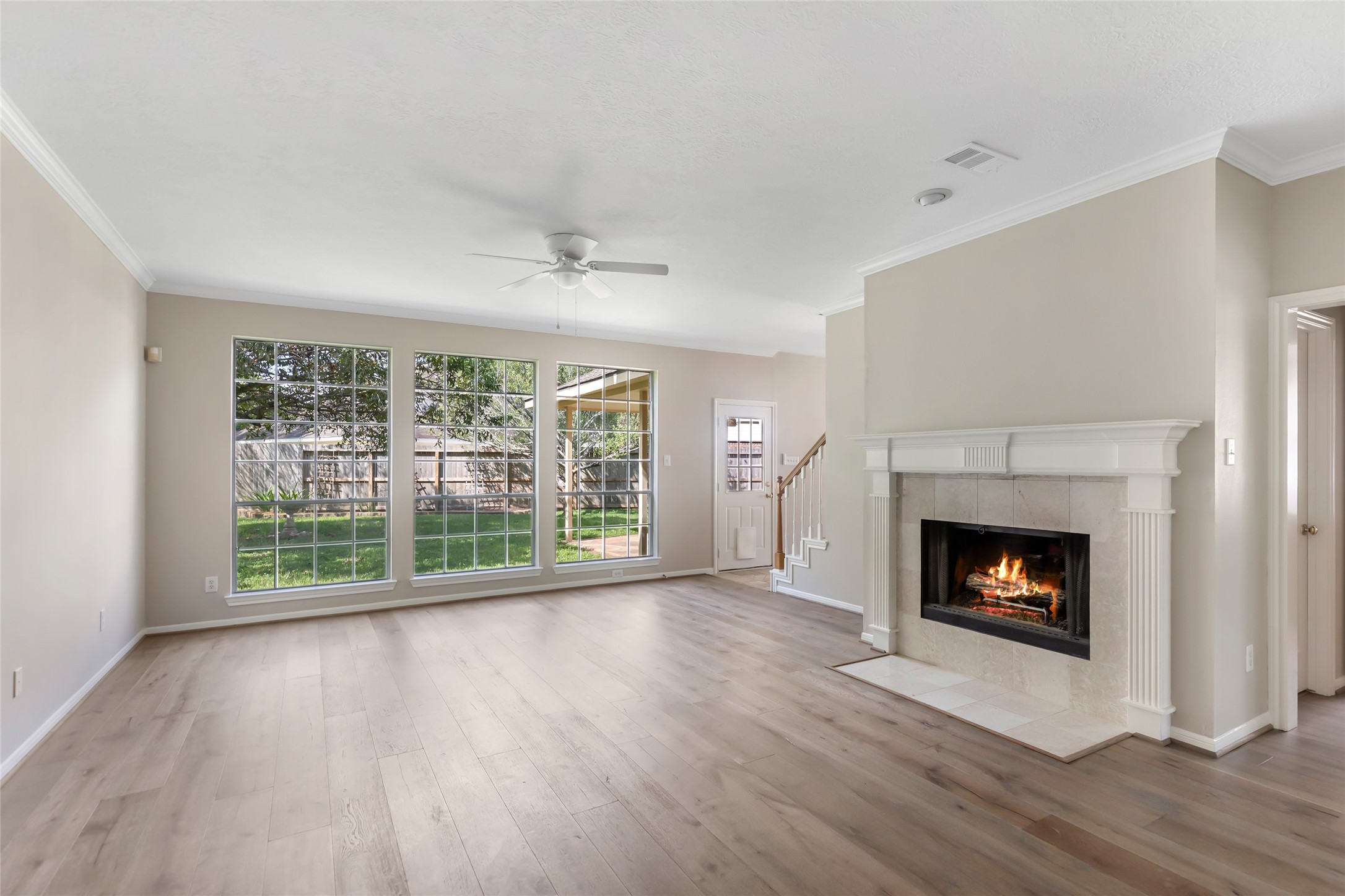 Flooring has just been updated to engineered wood flooring. Enjoy the gas log fireplace and large windows with lots of natural light sunlight.
