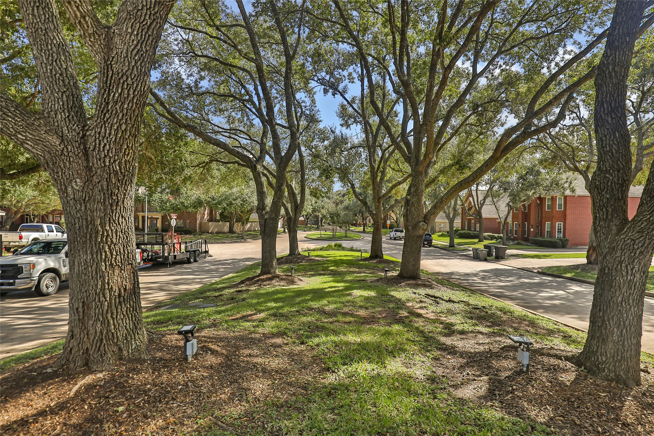 The whole neighborhood is lined with gorgeous trees hugging the streets. All the neighbors keep up with their yards.