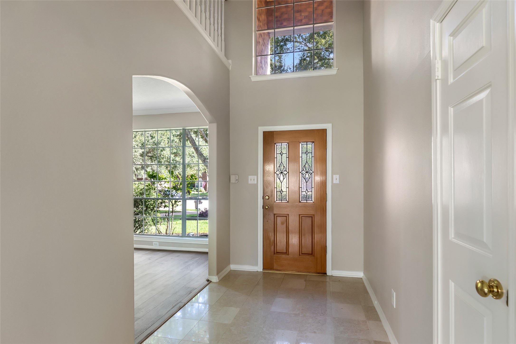 Welcoming entry and 2 story foyer