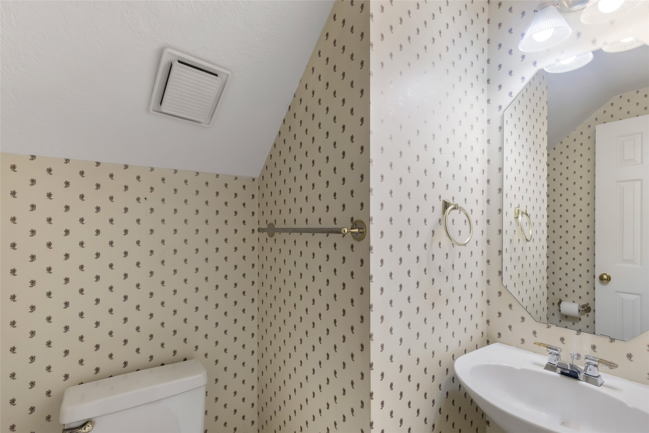 Half Bath downstairs by kitchen and living room