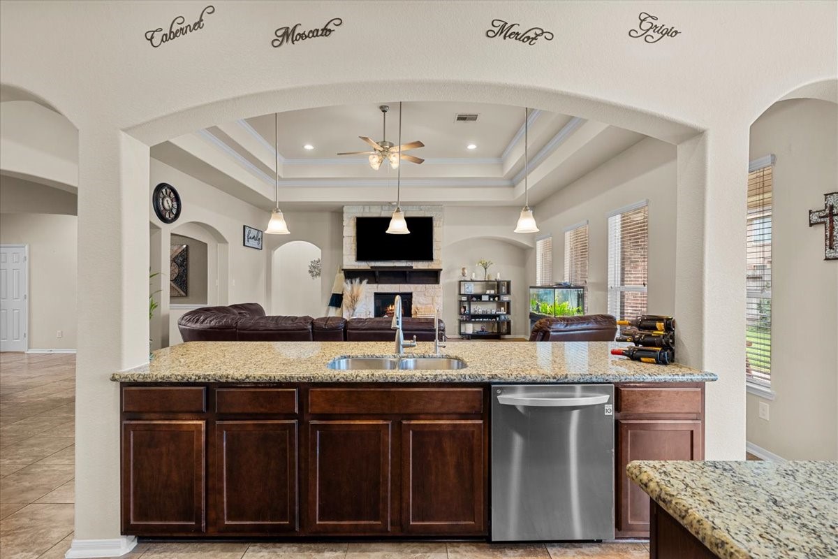 The kitchen breakfast bar overlooks the family room, so the cook is never left out.